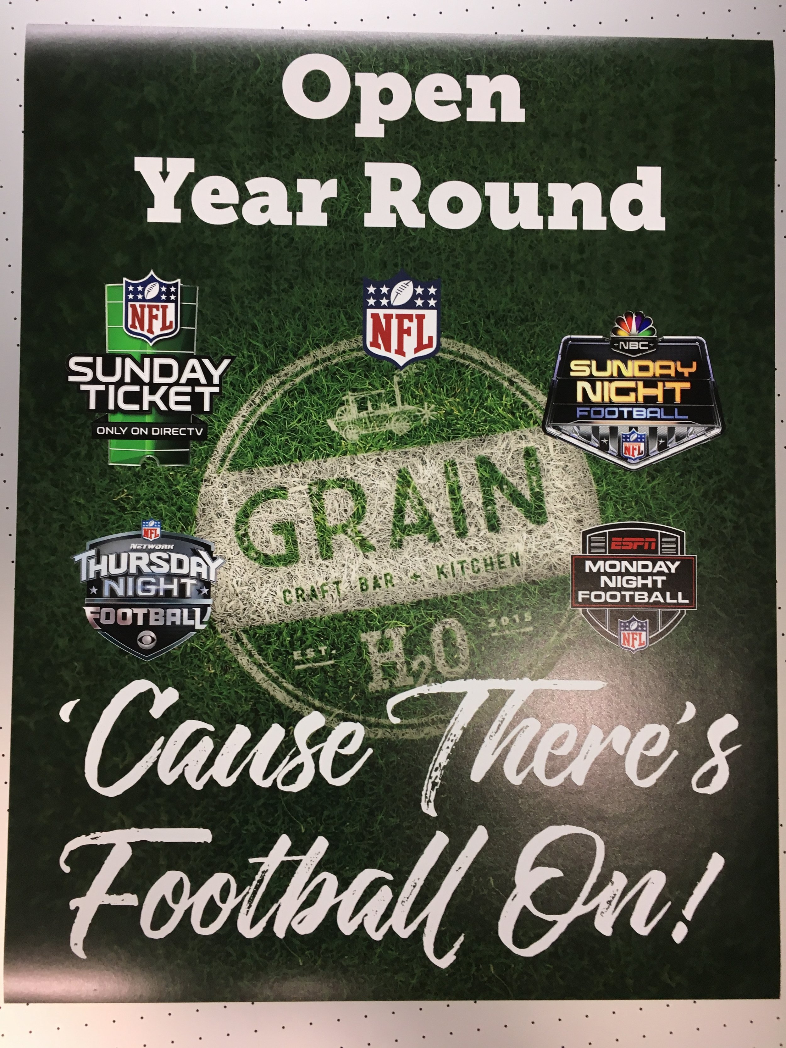 A promotional poster for an NFL football event called 'Open Year Round' at 'Grain Craft Bar & Kitchen,' featuring logos for NFL Sunday Ticket, NFL Thursday Night Football, NFL Sunday Night Football, and ESPN Monday Night Football, with the text 'Caus