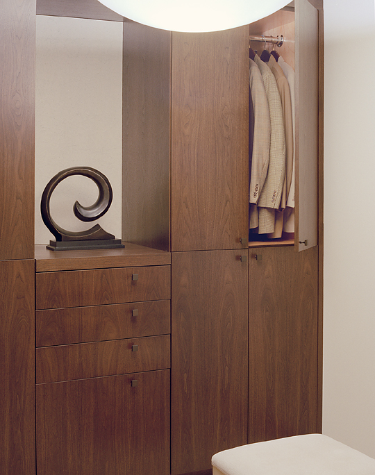 Walnut walk in master closet.