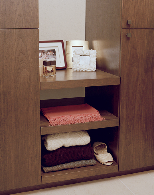 Walnut wardrobe in the walk in closet area