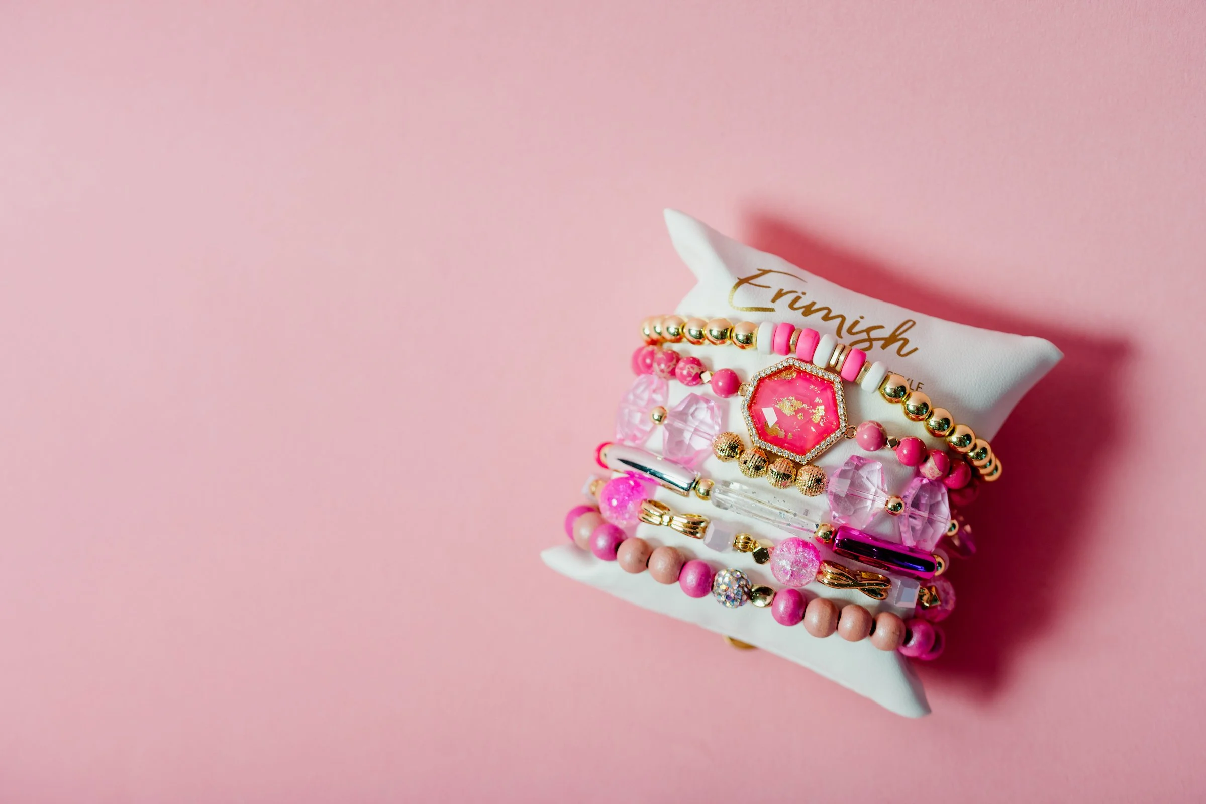 erimish jewelry product photo on pink background.jpg