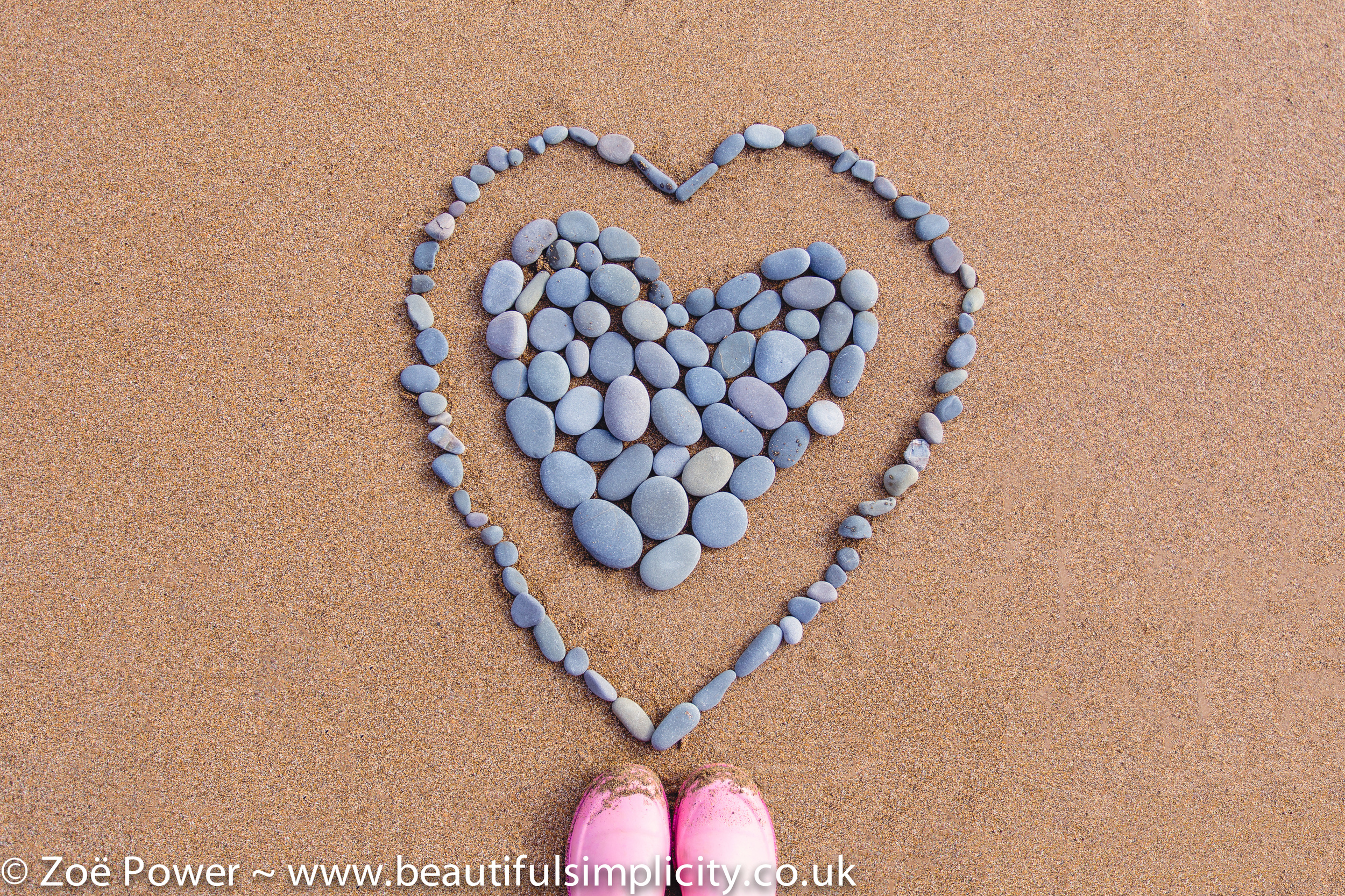 Fun with pebbles at Sandymouth beach