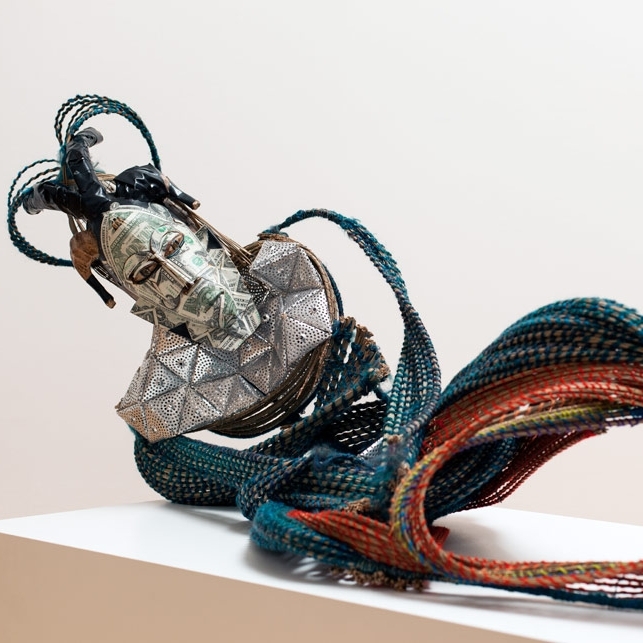 ADEJOKE TUGBIYELE The work of Nigerian-American activist and visual artist Adejoke Tugbiyele spans several media, including film, sculpture and works on paper. Known primarily for the handcrafted figures she assembles from repurposed materials,