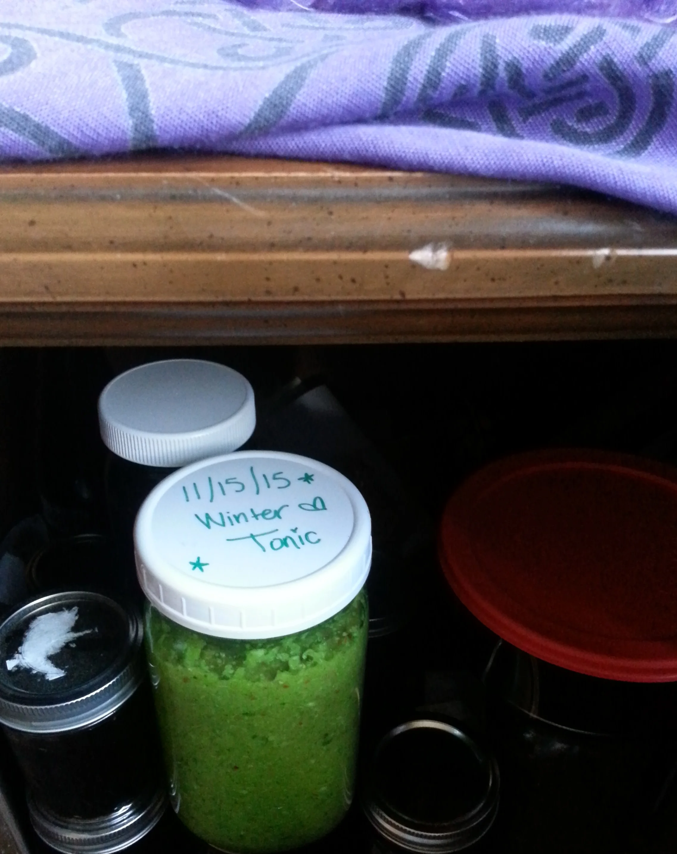 I like to store my tonic and all my other crafty home-remedies in my altar. It's cool, dark, off the ground and most of all, a sacred space to add even more positive energy and potential into my tonics!