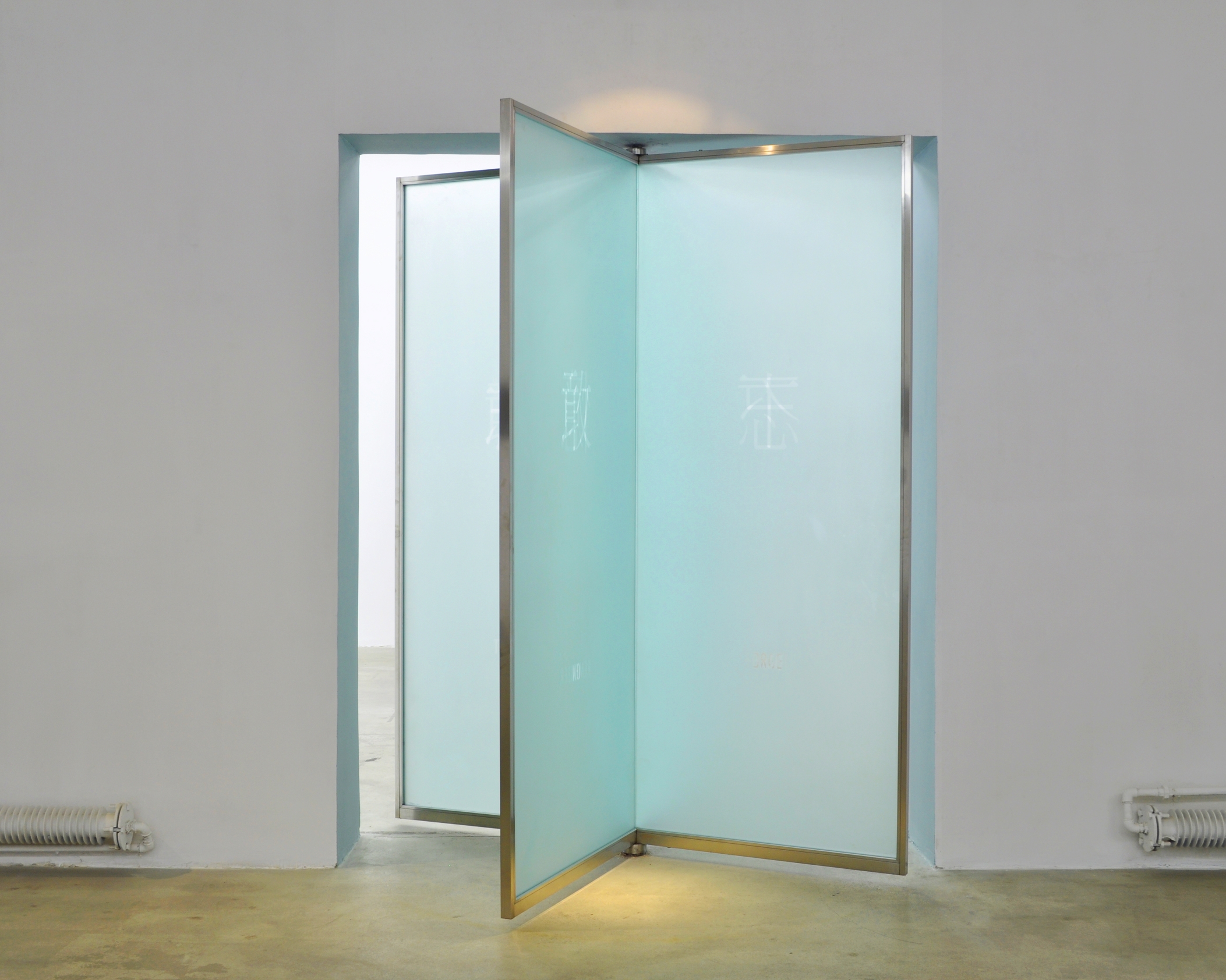 A revolving door was installed at the passage way of the gallery. 8 sets of texts are superimposed on the 4 panels of the revolving doors: Chinese: 不 /忘 敢/憶. 不/憶 敢/忘 English: Dare/Forget No/Remember Dare/ Remember No/Forget The 'Dare, No' in English are in reverse of the meanings of the Chinese 不,敢. When it reads 敢 (Dare) in Chinese, the English reads No, and vice versa.
