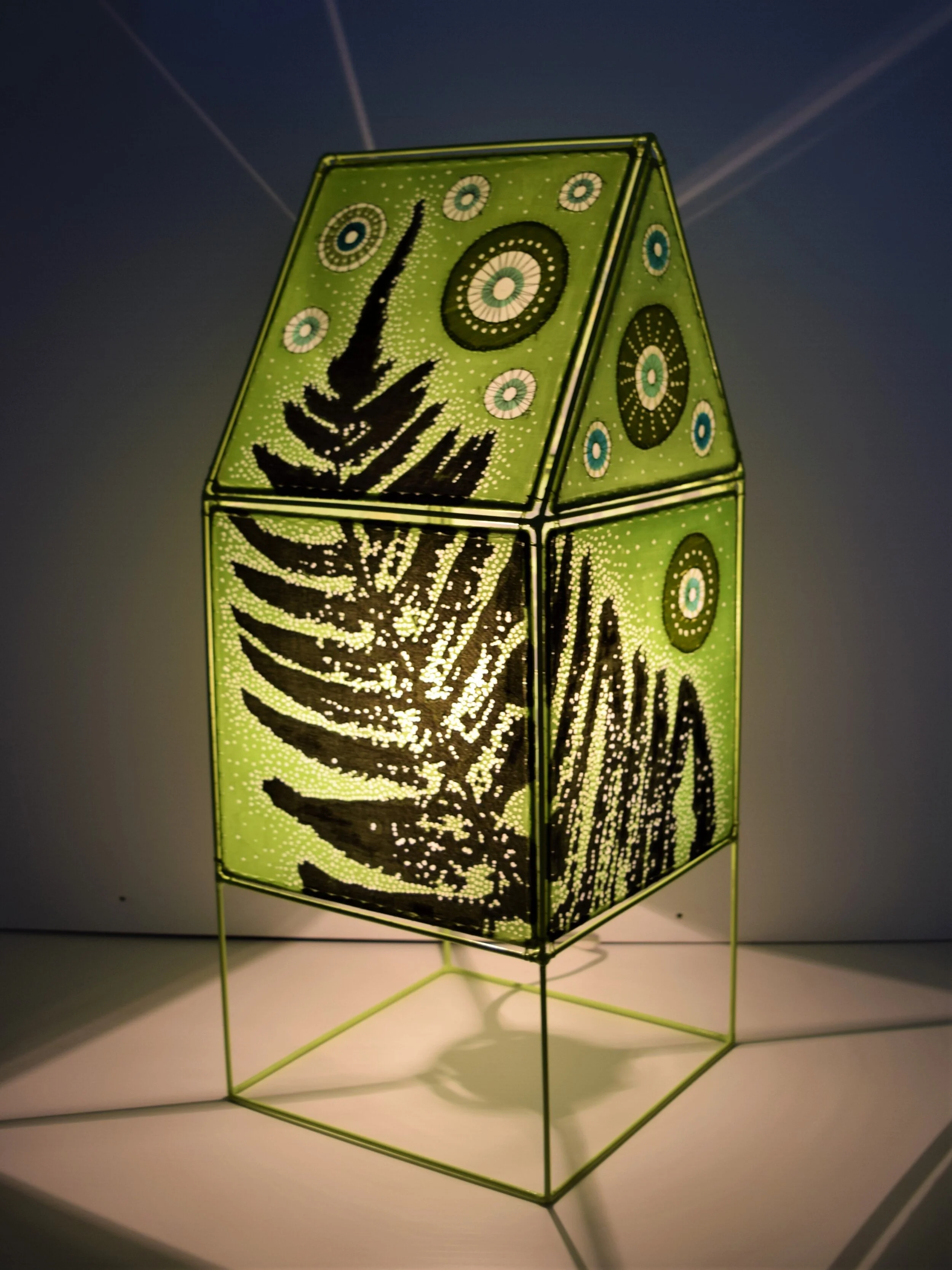   ''Fern Light House''   2019  21’’ x 8 1/2’’ x 8 1/2’’  Recycled welded wire, recycled polyester fabric, ink and light.   