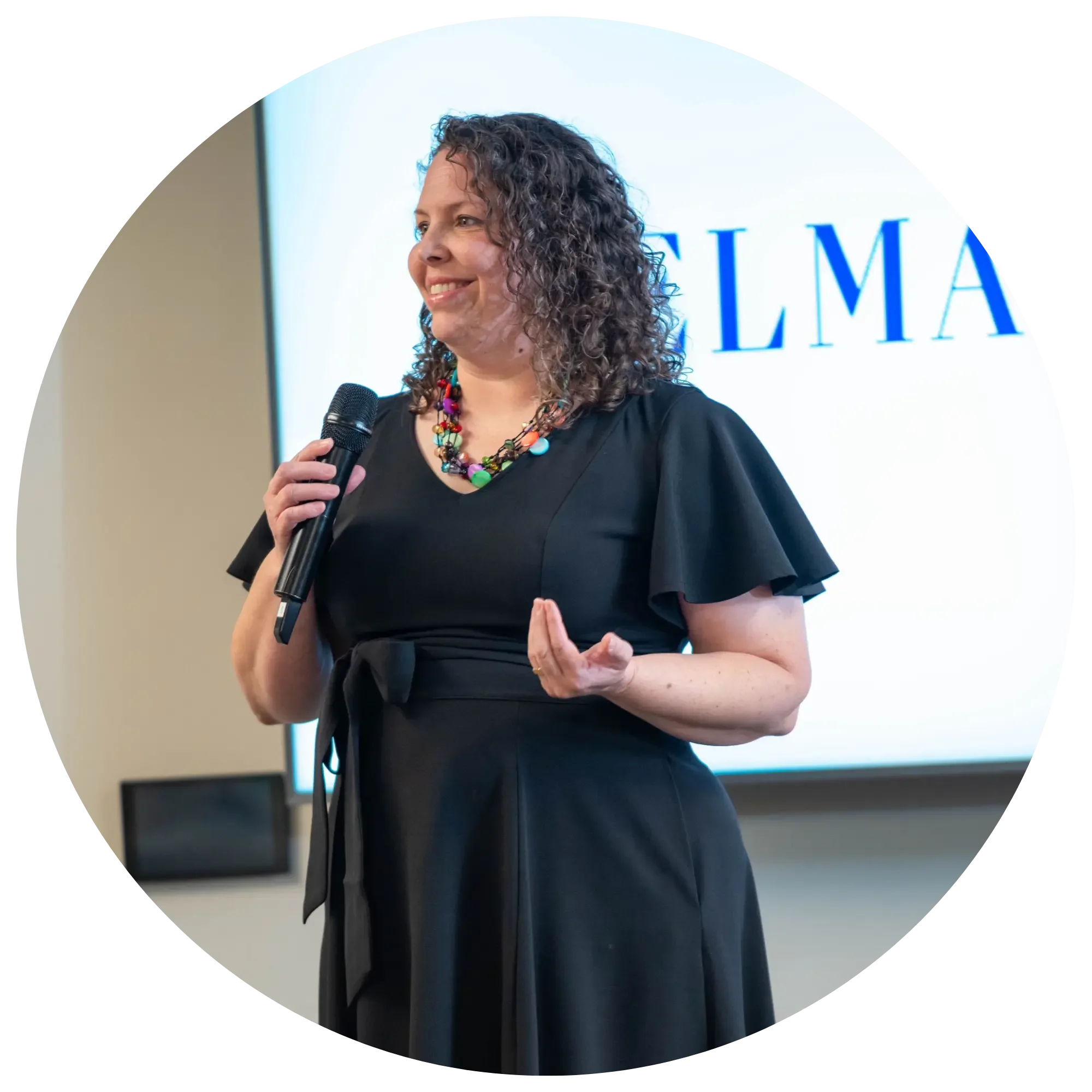 Ellen Marie Tanner speaking to an audience about organizational culture, leadership, burnout prevention, and sustainable workplace change.