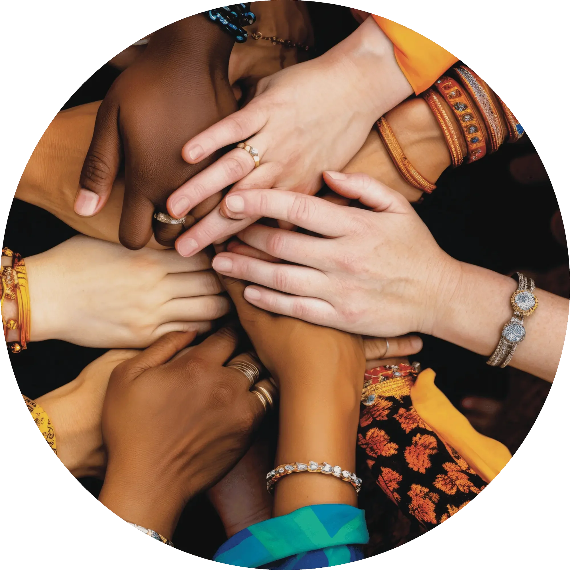 Hands of people with diverse skin tones joined together, representing connection, shared responsibility, and building a more sustainable future together.