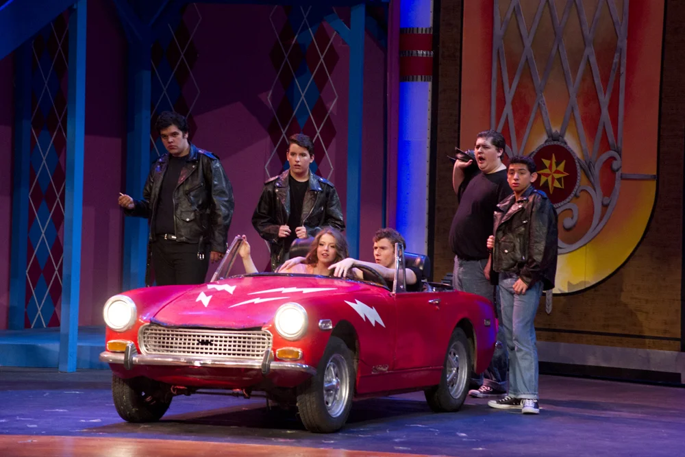 Grease Directed by: Maggie Rodriguez Production Designer and Technical Director: Joshua Heerssen