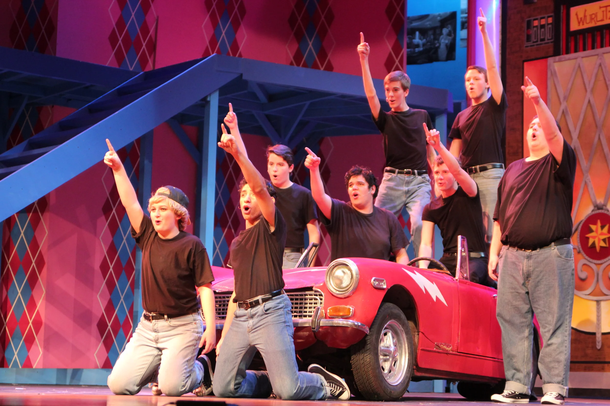   Grease   Directed by: Maggie Rodriguez  Production Designer and Technical Director: Joshua Heerssen 