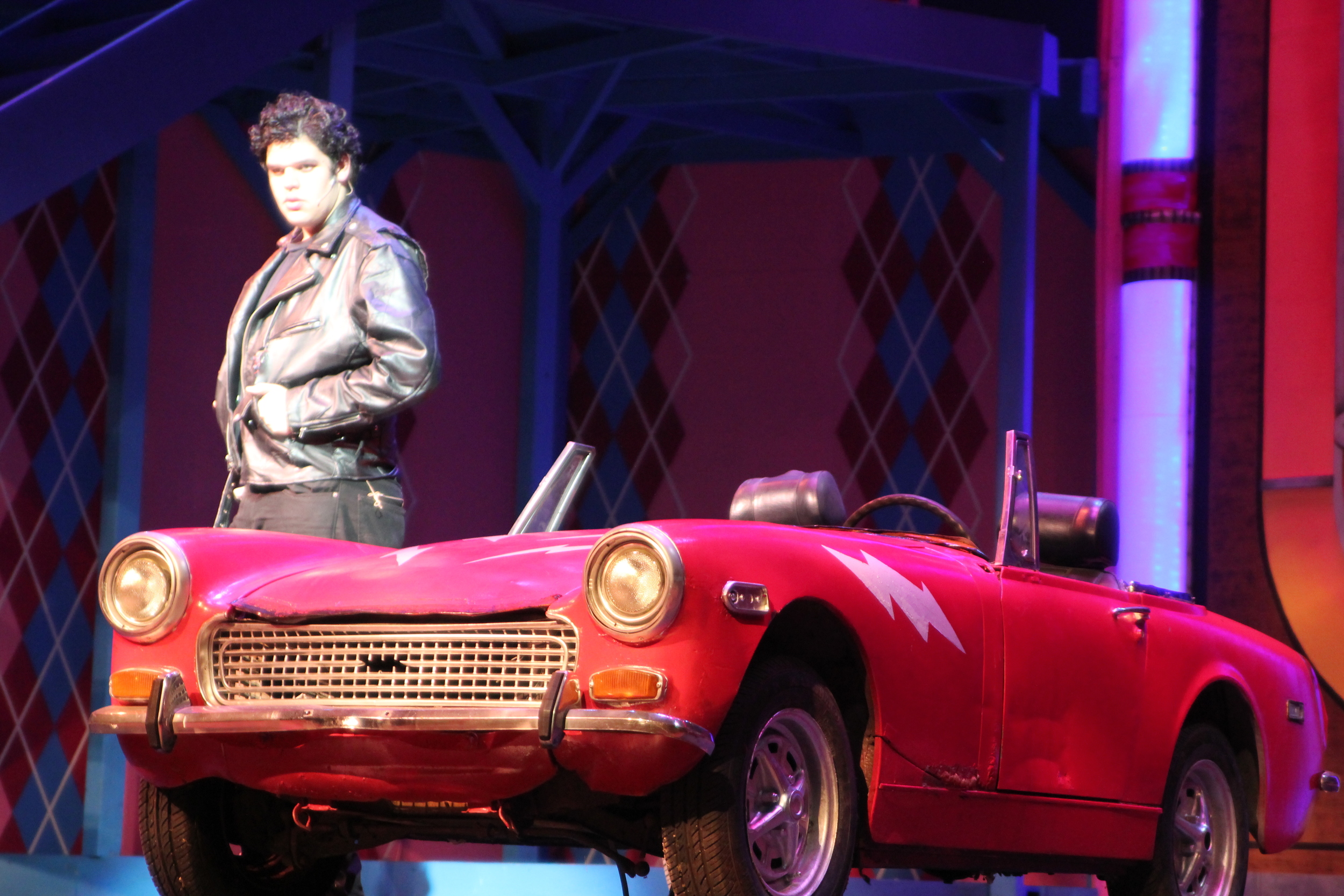   Grease   Directed by: Maggie Rodriguez  Production Designer and Technical Director: Joshua Heerssen 