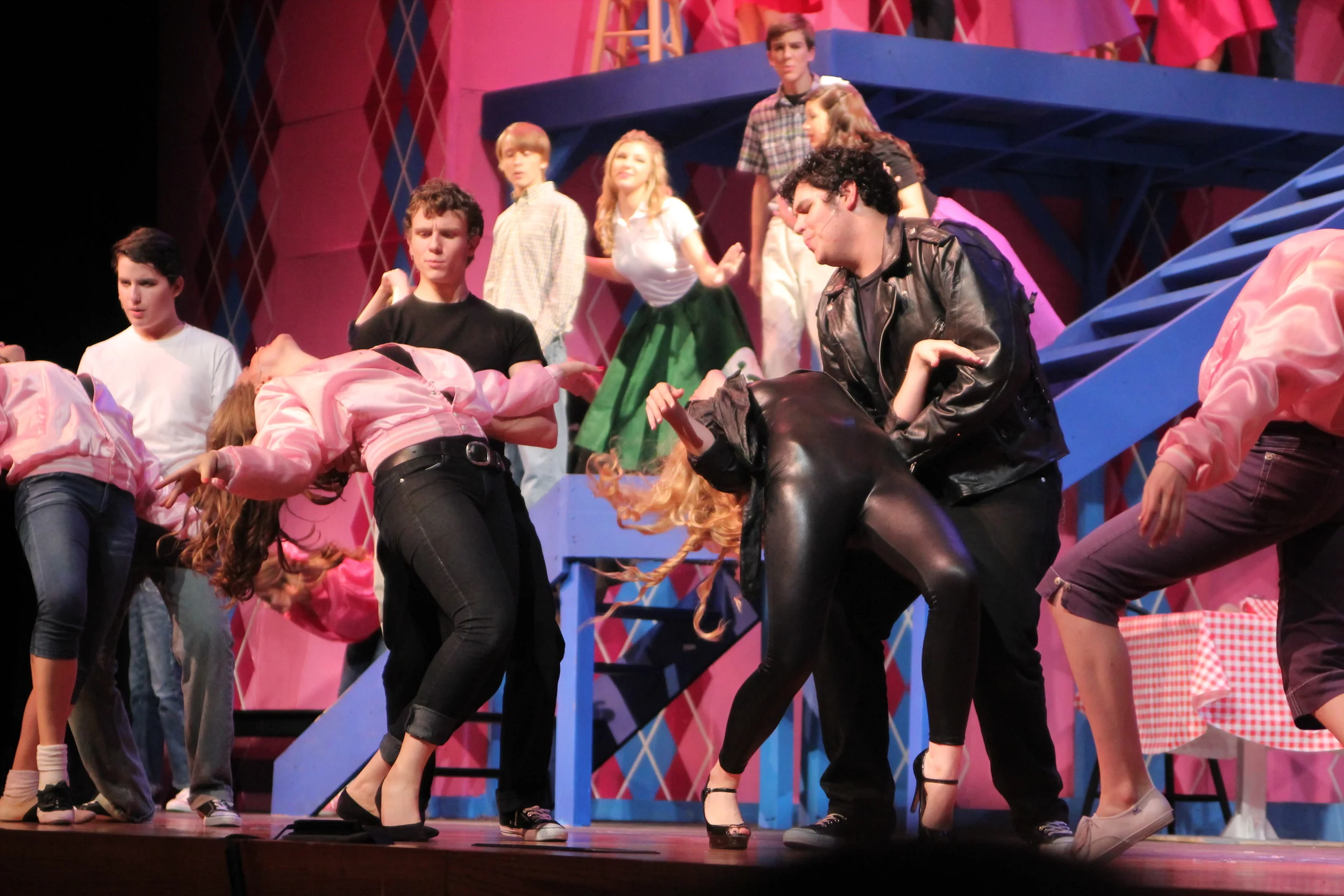   Grease   Directed by: Maggie Rodriguez  Production Designer and Technical Director: Joshua Heerssen 