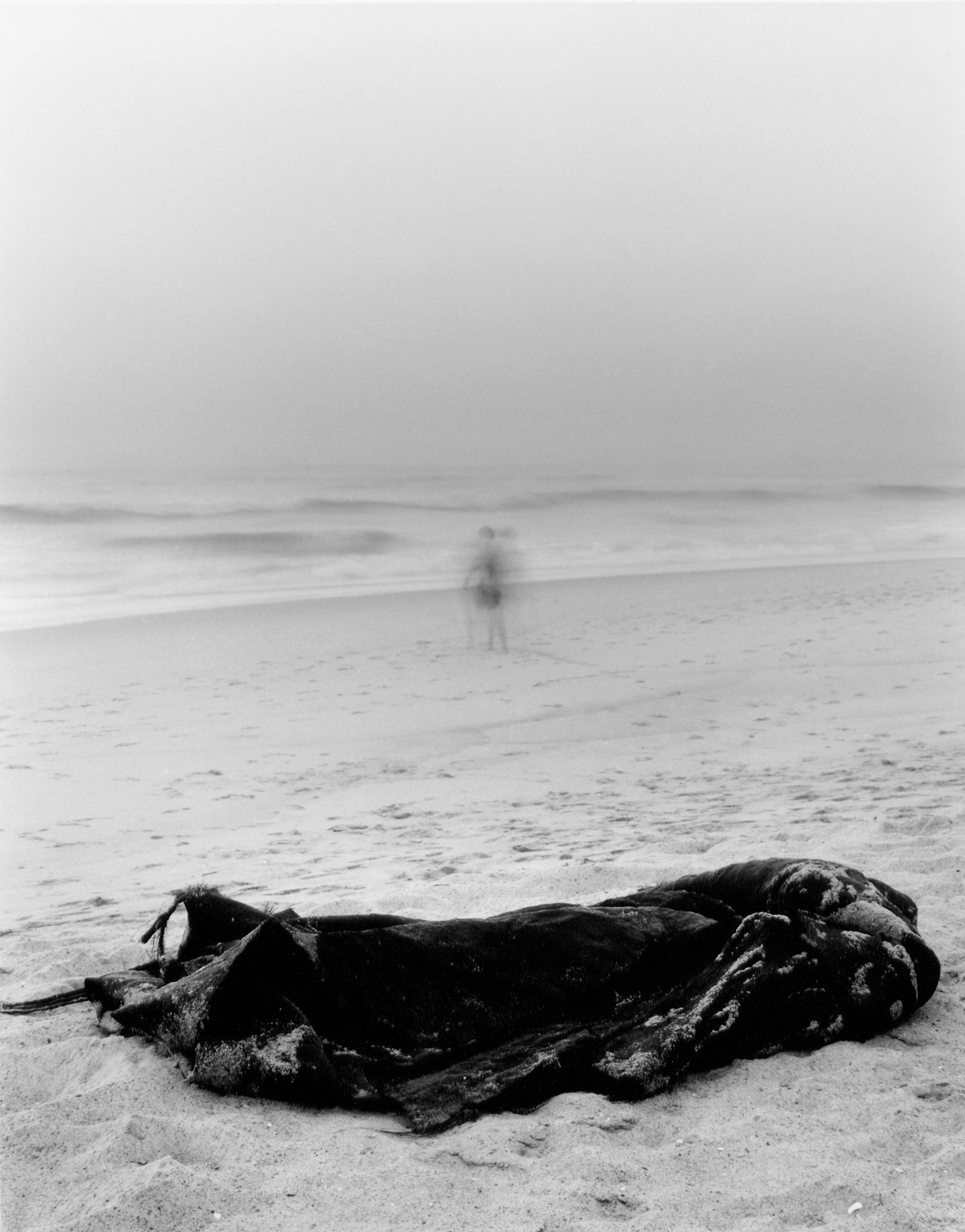 Passing (man on the beach)