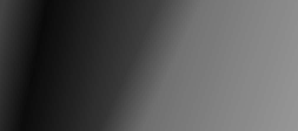 A plain, gradient background transitioning from black to gray.