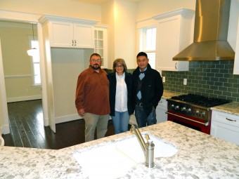 Marsha, with Parkwood superintendent Sam and her broker, Karl, in her beautiful new kitchen just before moving in.