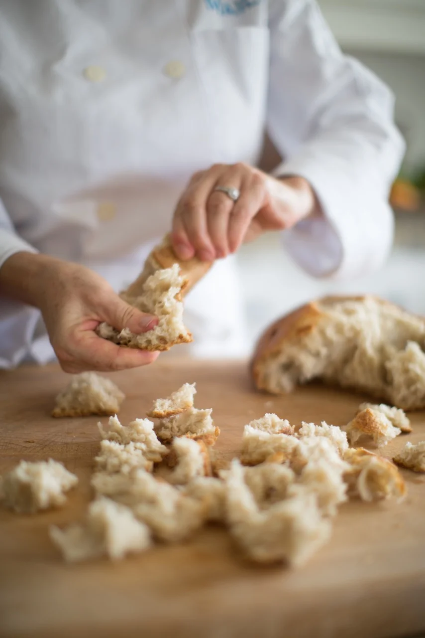 Tearing the beautiful sourdough Levain from The Bakers' Table to make croutons. You can also cut the bread into squares, but I love the look of the hand-torn pieces.