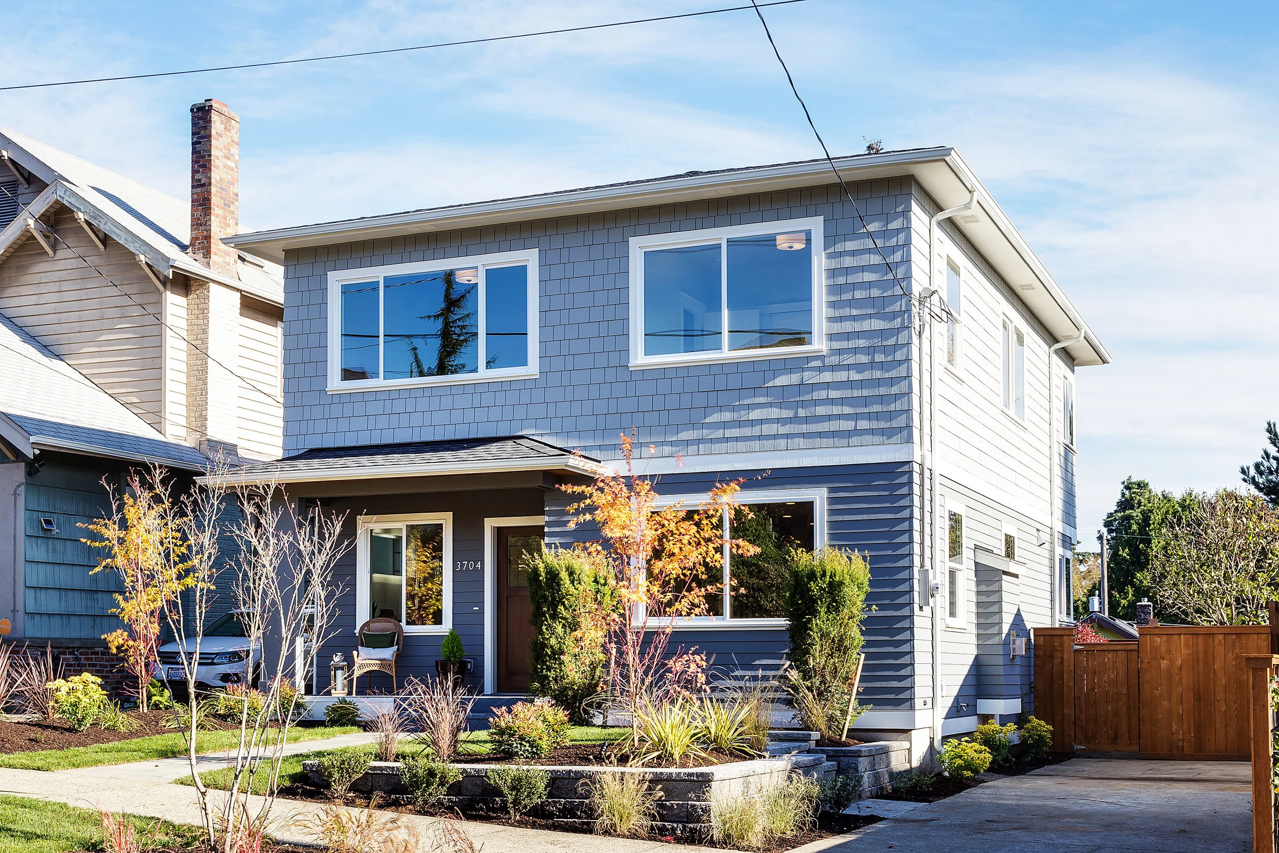 This terrific new 2 story home sits quietly in Wallingford w/ Lake Union views. A superb floor plan w/ large entry, white oak floors, great room w/ fireplace, separate family room & 4 beds/2 baths on the 2nd level. Entertain in the massive kitchen, 35 SF island, beautiful gas range & adjacent dining area. The master suite features a 5 piece bath, deck & Lake Views from both! Space needle views from the SW bedroom, large deck on the main, home warranty, close to Gas Works Park, Fremont and UW!