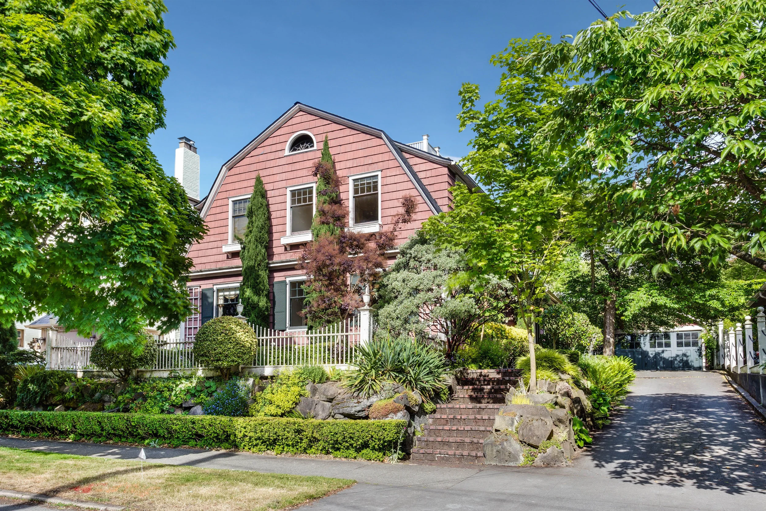 The Sunset Club architect, Joseph Cote, designed this wonderful Dutch Colonial home in 1914. Privately situated on a 6000 SF lot & tree lined street, the sophisticated 2 story floor plan features period details & hardware in tact. Tall ceilings, grand staircase, massive living room w/ fireplace, 4 bedrooms, charming den, master w/ fireplace, formal dining, large kitchen & eating nook. Rare 2 car garage, 7.5' basement. Kitty corner to Volunteer Park, rooftop deck w/ Space Needle & Sound views! 4 bedrooms, 2 baths, 2 story with basement home, 3080 above ground square feet, 1270 SF basement, 6000 SF lot, 2 car garage, private yard. As seen in the Seattle Post Intelligencer: http://www.seattlepi.com/realestate/article/Get-this-Cap-Hill-home-designed-by-prominent-11223255.php