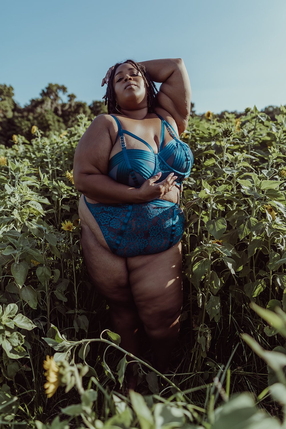  sexual empowerment coach poses in blue lingerie during her first-ever boudoir shoot in Florida 
