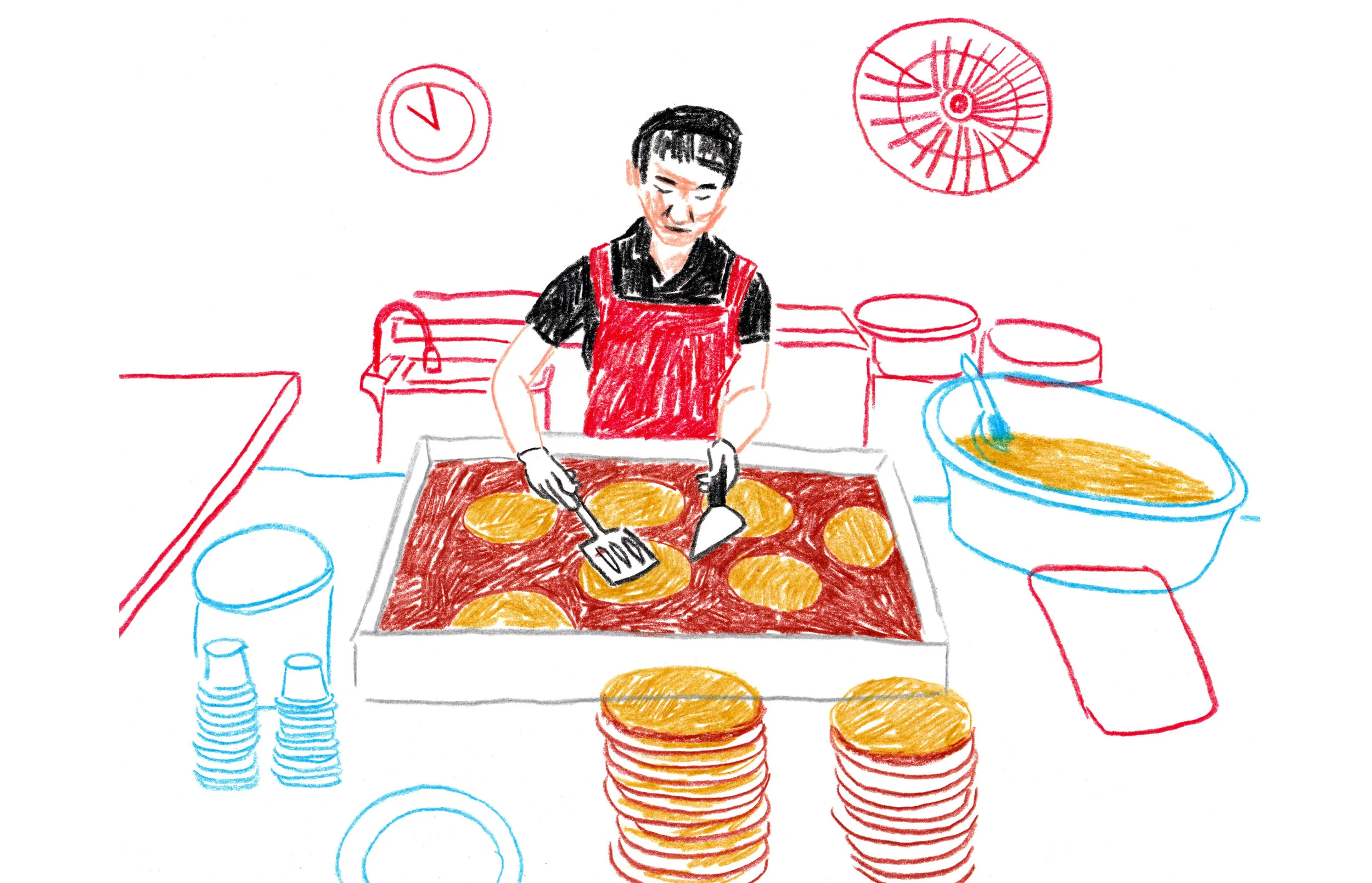 Woman cooking bindaetteok at Gwangjang Market, Seoul.
