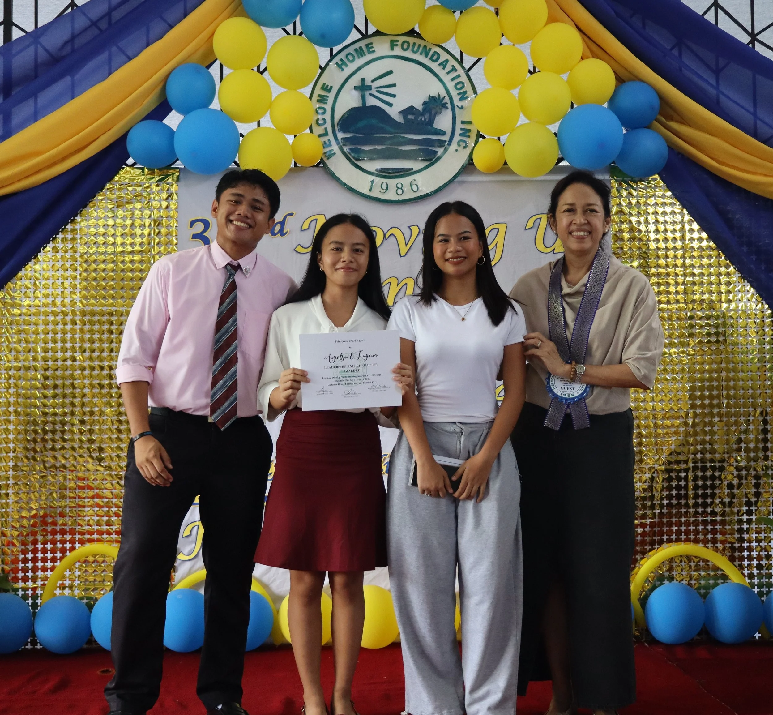 LD Graduate receiving a scholarship to study at the College of Saint Benilde
