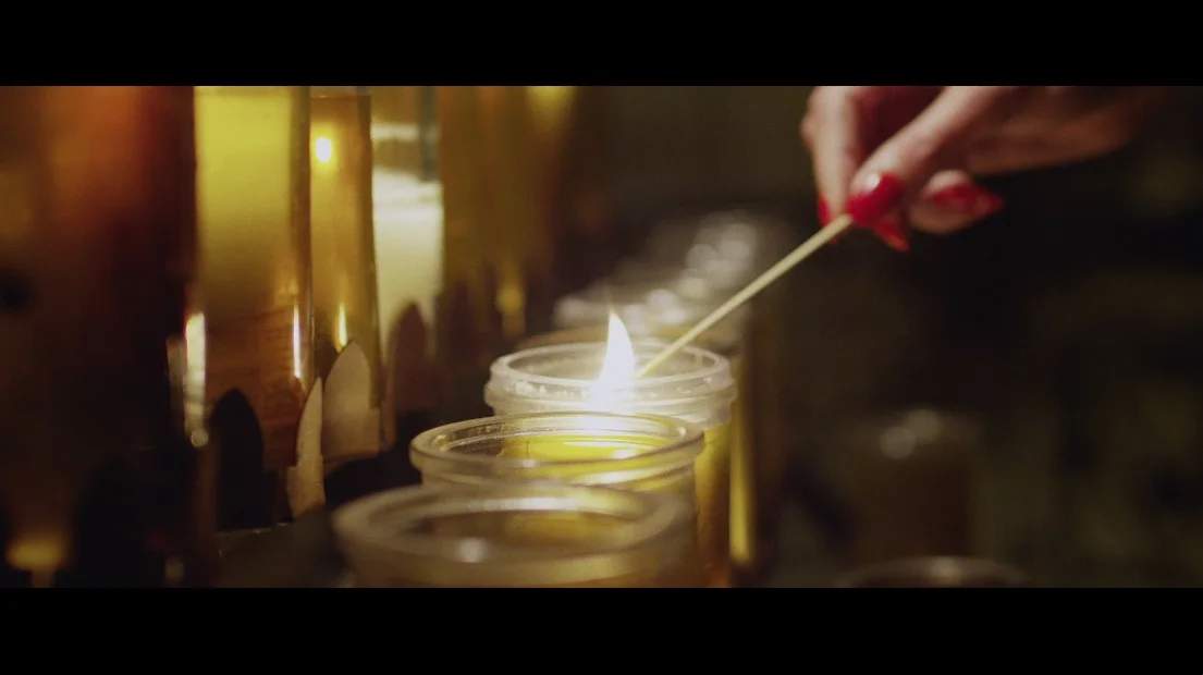 esther lighting candle.jpg