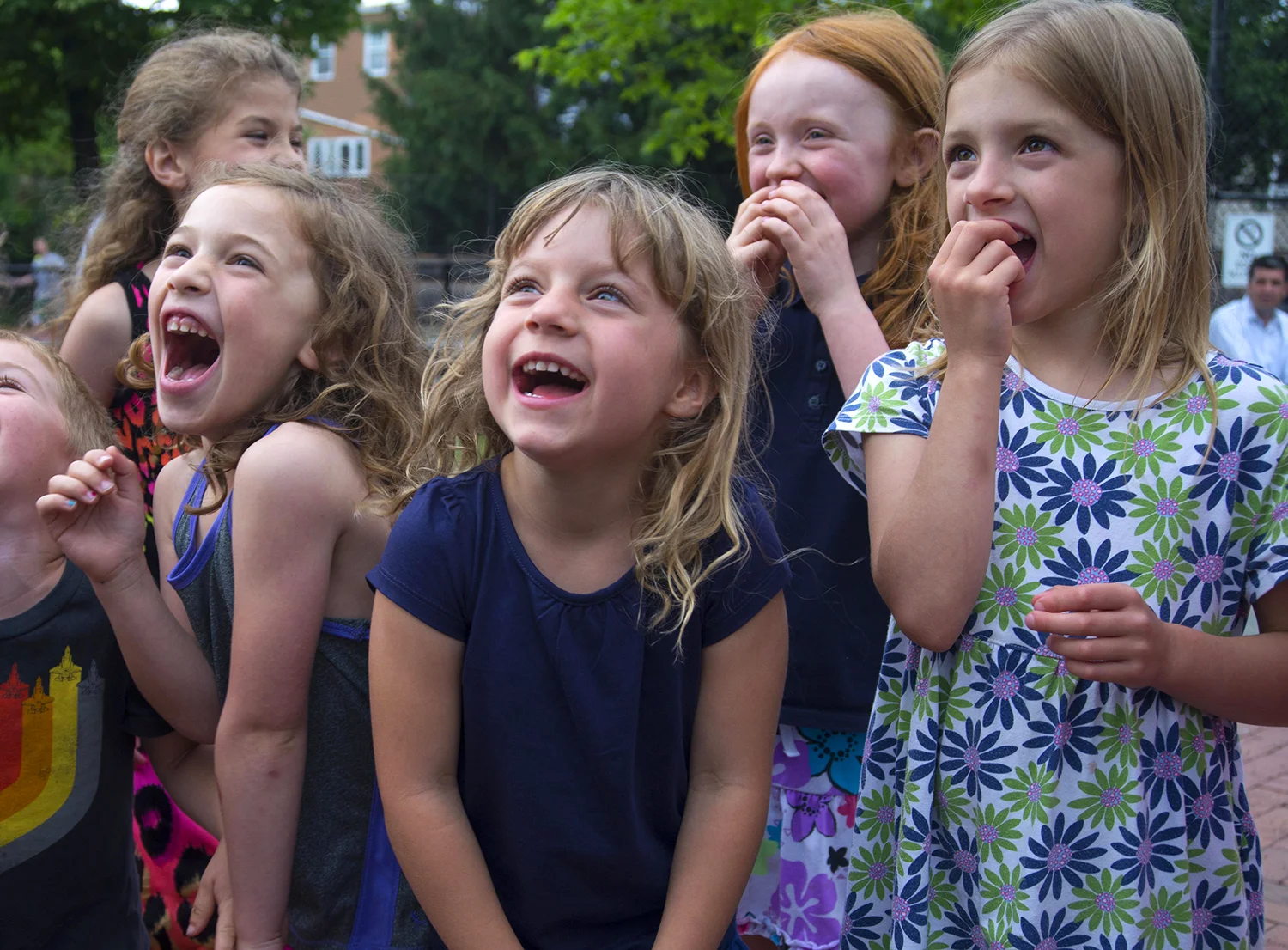 A group of kids enjoying a magic show at Charlestown, Boston.