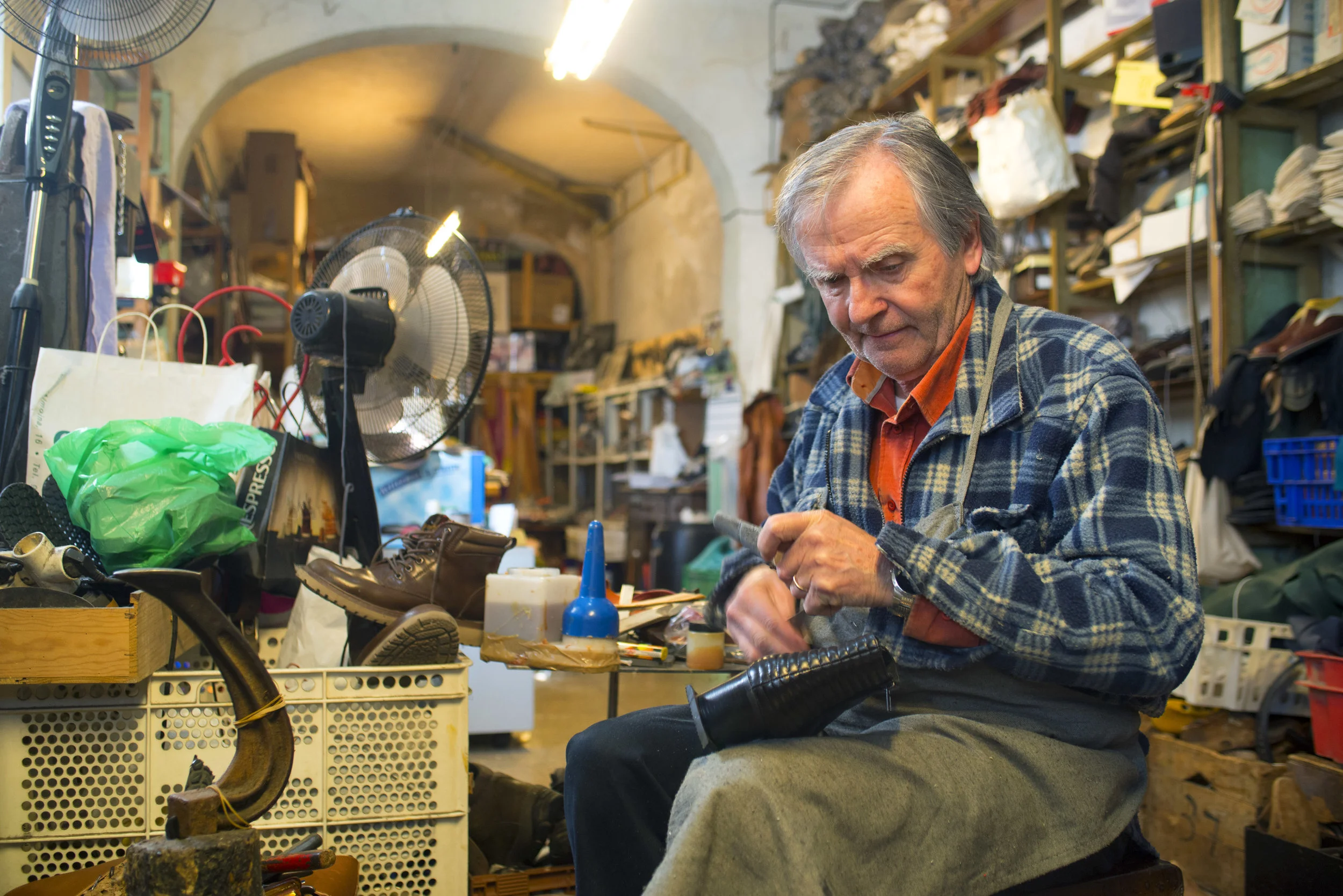 Fixing a shoe at Calcite Sellers Porreres, Mallorca, Spain. 