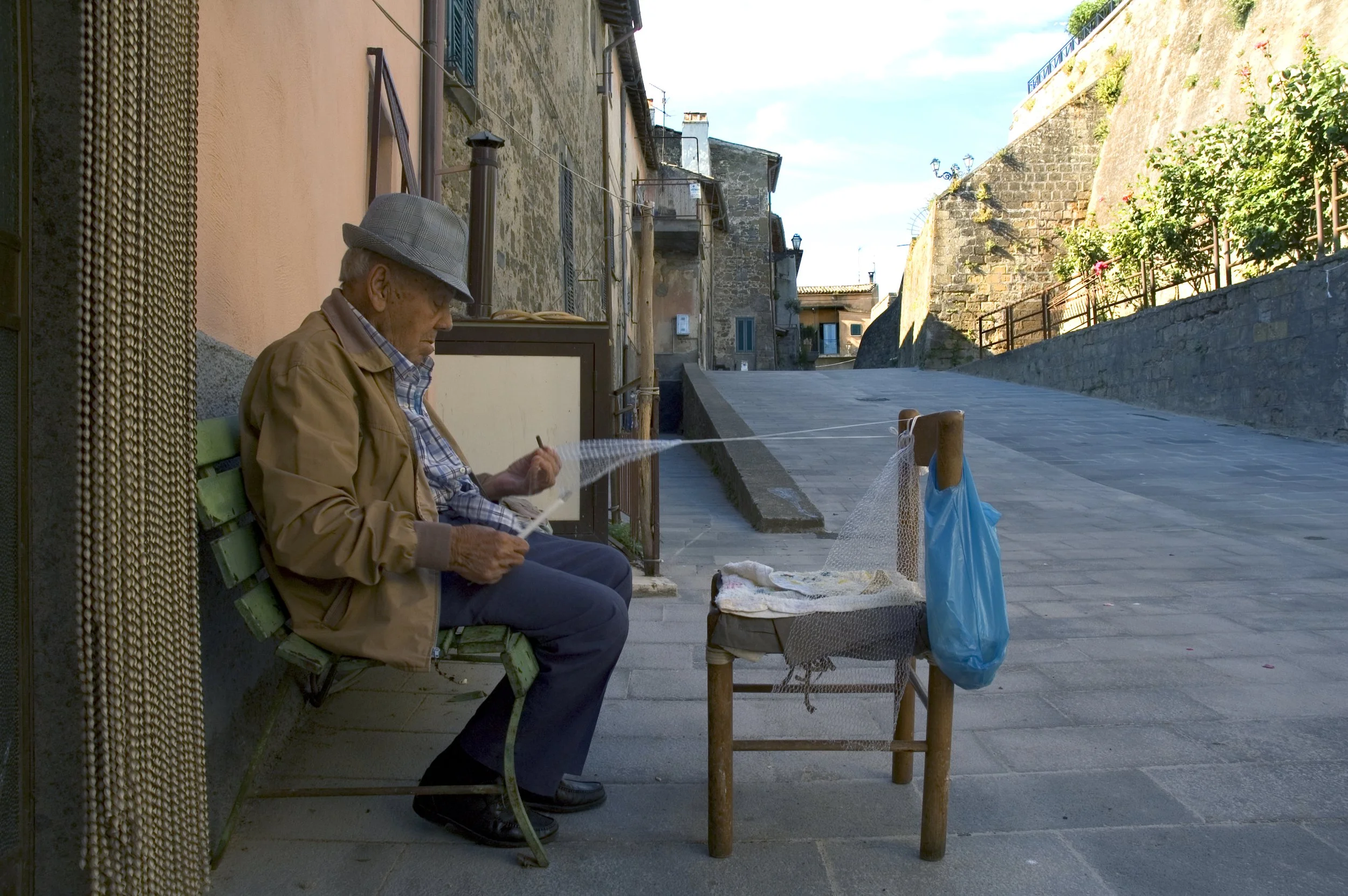  He is making a fishnets. Marta, Italy.     