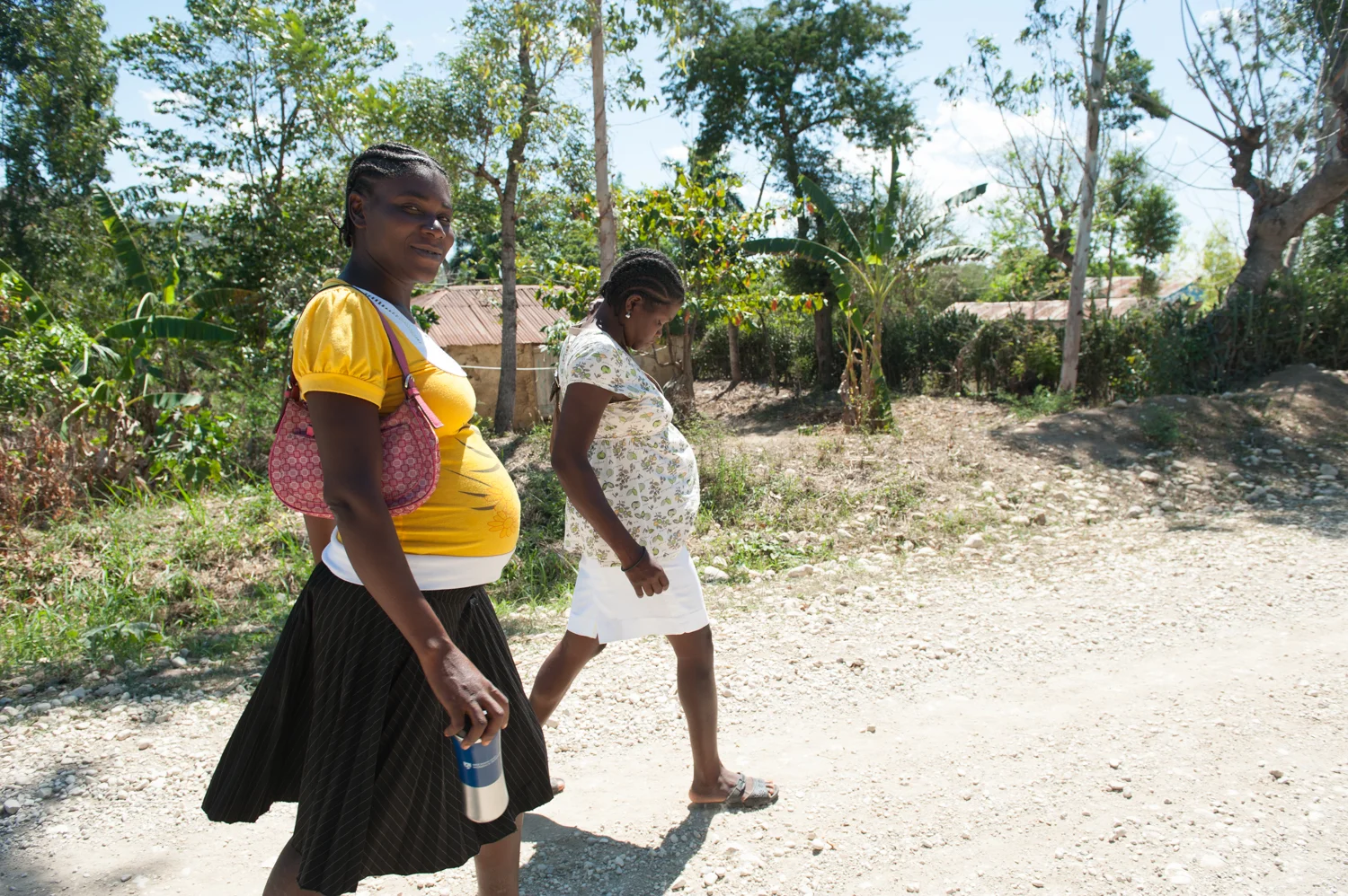 Elene and Adrienne walk to and from prenatal clinic for the reassurance that care from Skilled Birth Attendants can give.