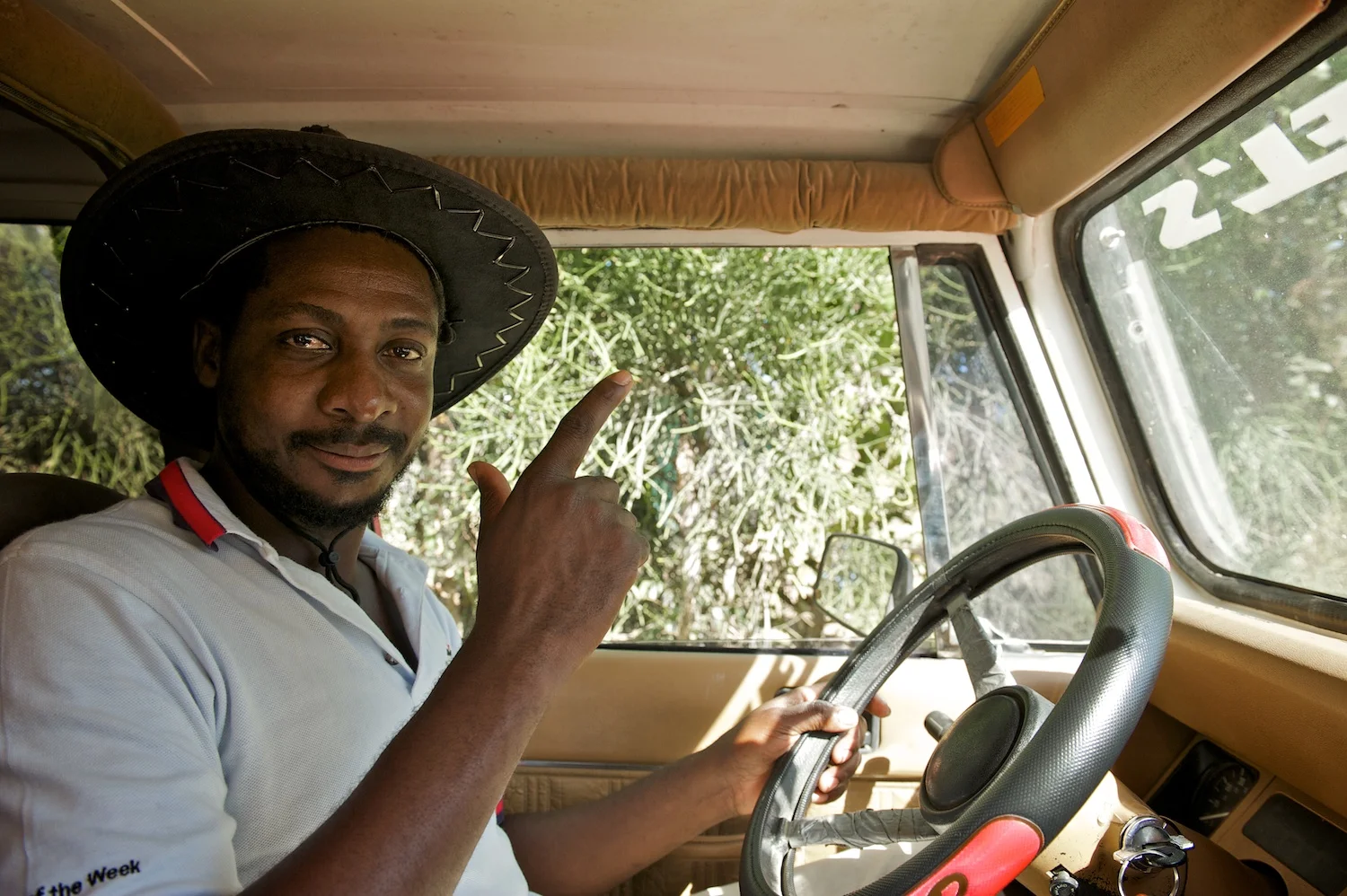 Ronel, driver and mechanic extraordinaire, navigates through river crossings, steep hills, and rough rutted roads. The jeep carries SBAs, volunteers, supplies to clinics.