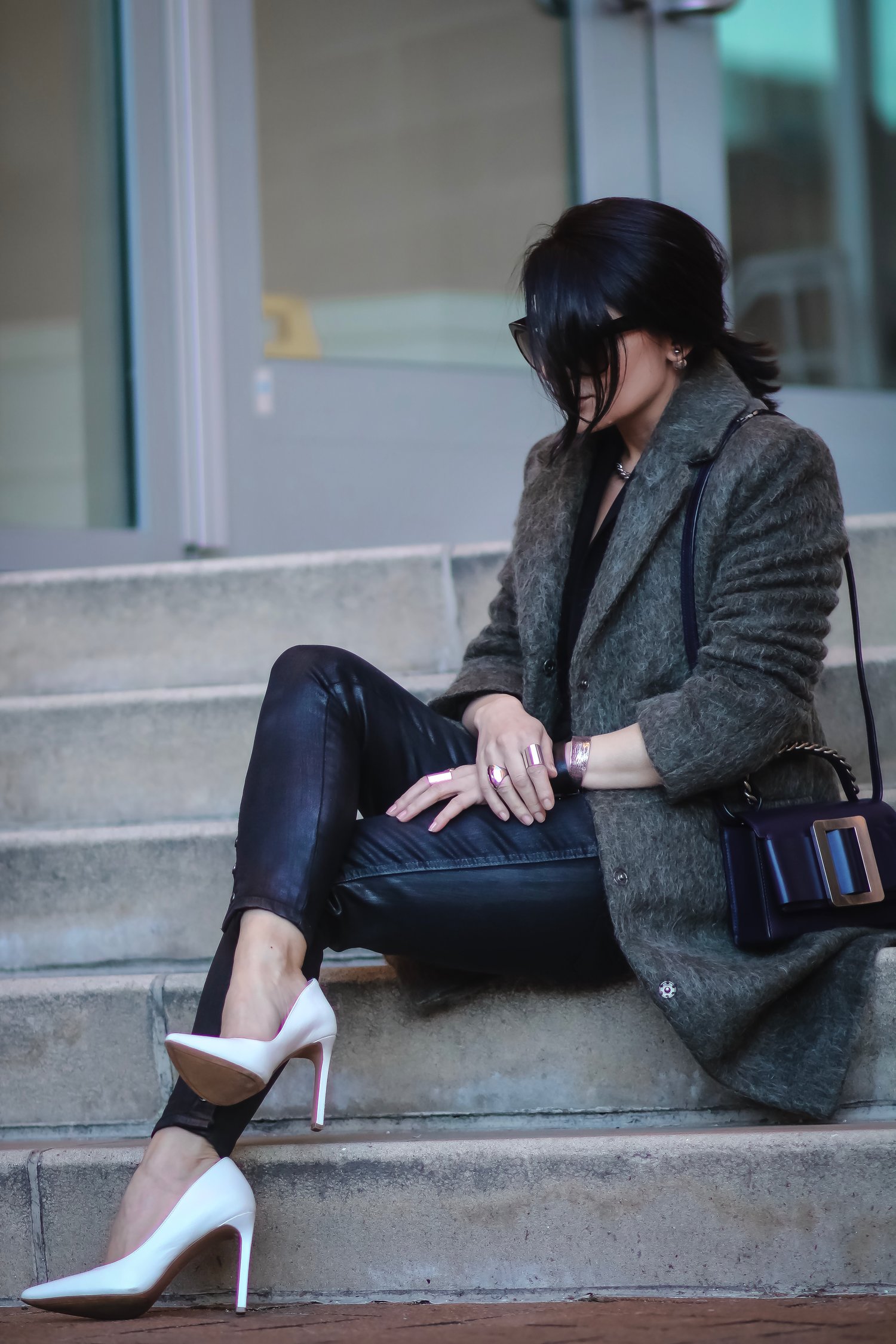 Isabel-Alexander-Wearing-Asos-khaki-textured-coat-sitting-down