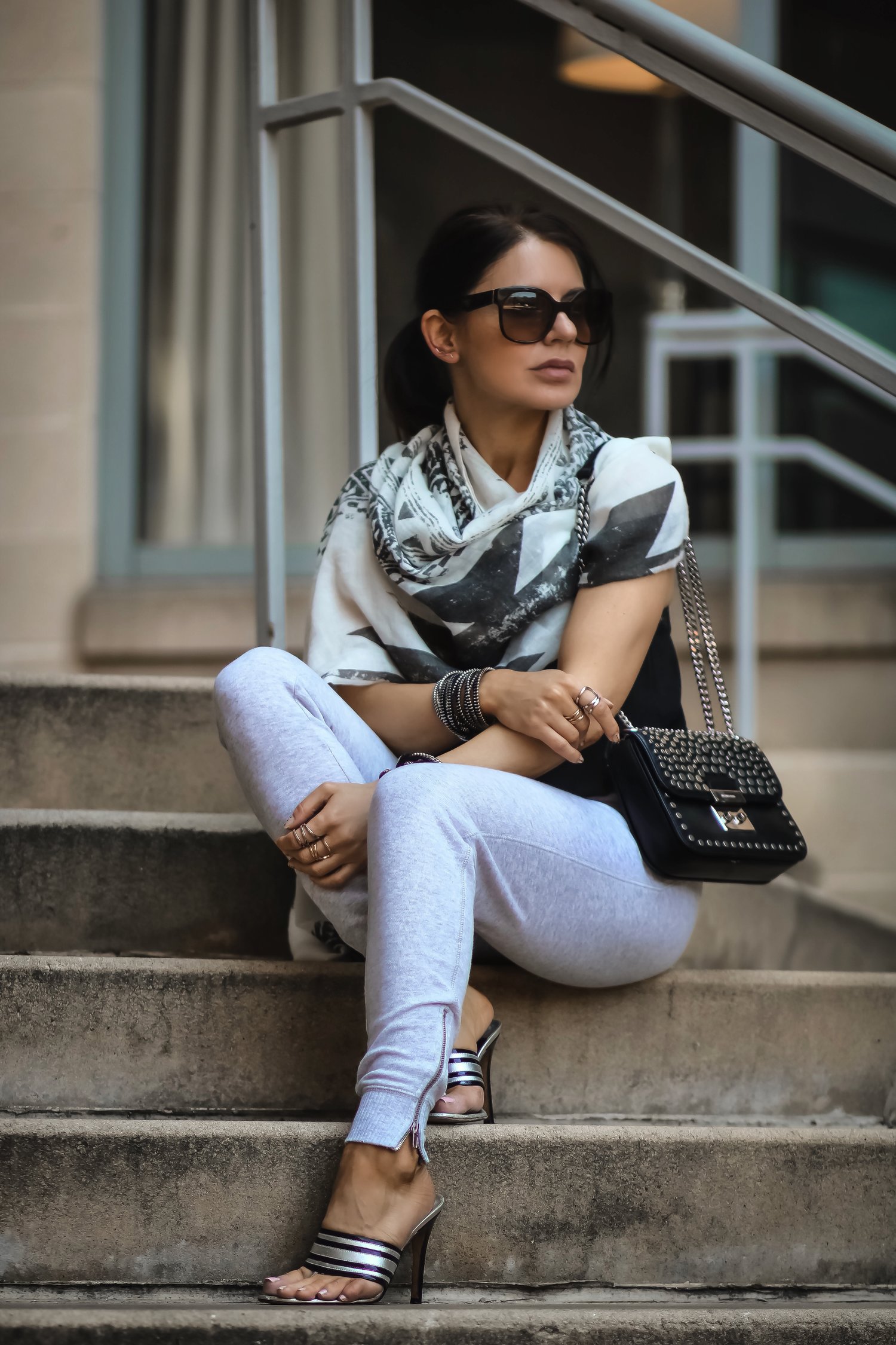 Isabel-Alexander-sitting-down-stairs-Michael-Kors-bag.jpeg
