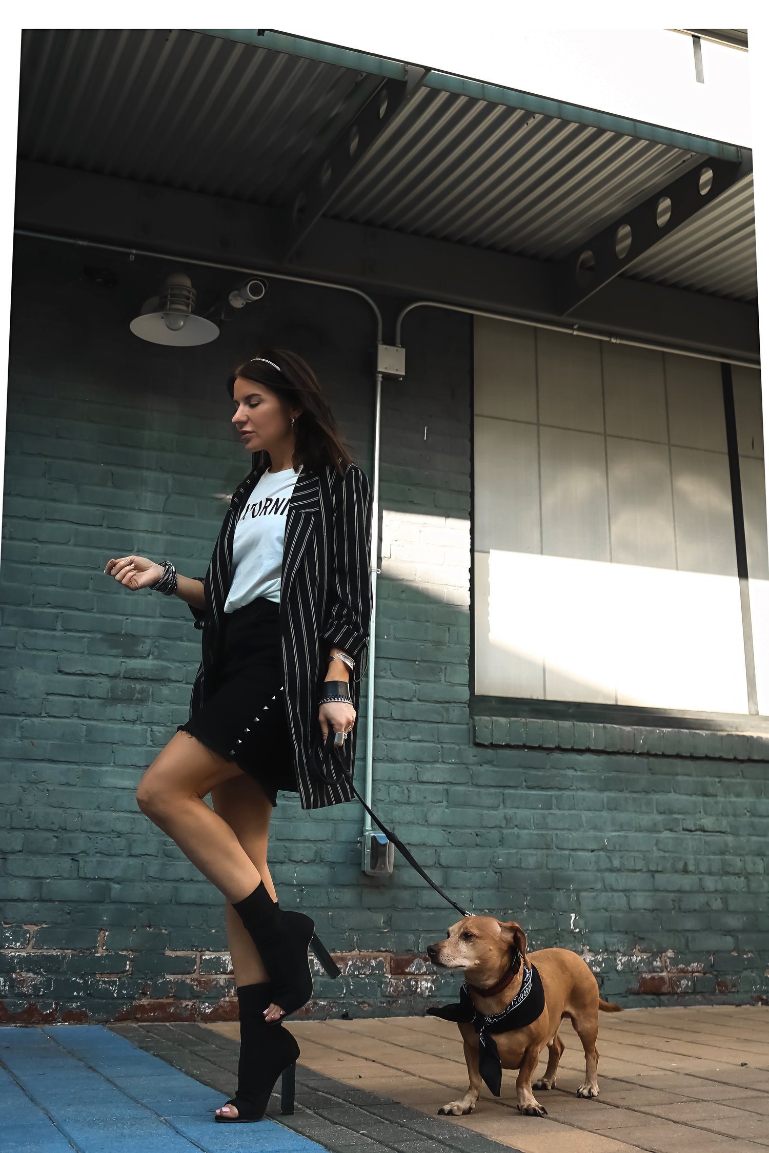 Isabel Alexander With Her Daschund Dog Wearing Boyfriend Blazer and Frayed Denim Skirt Street Style