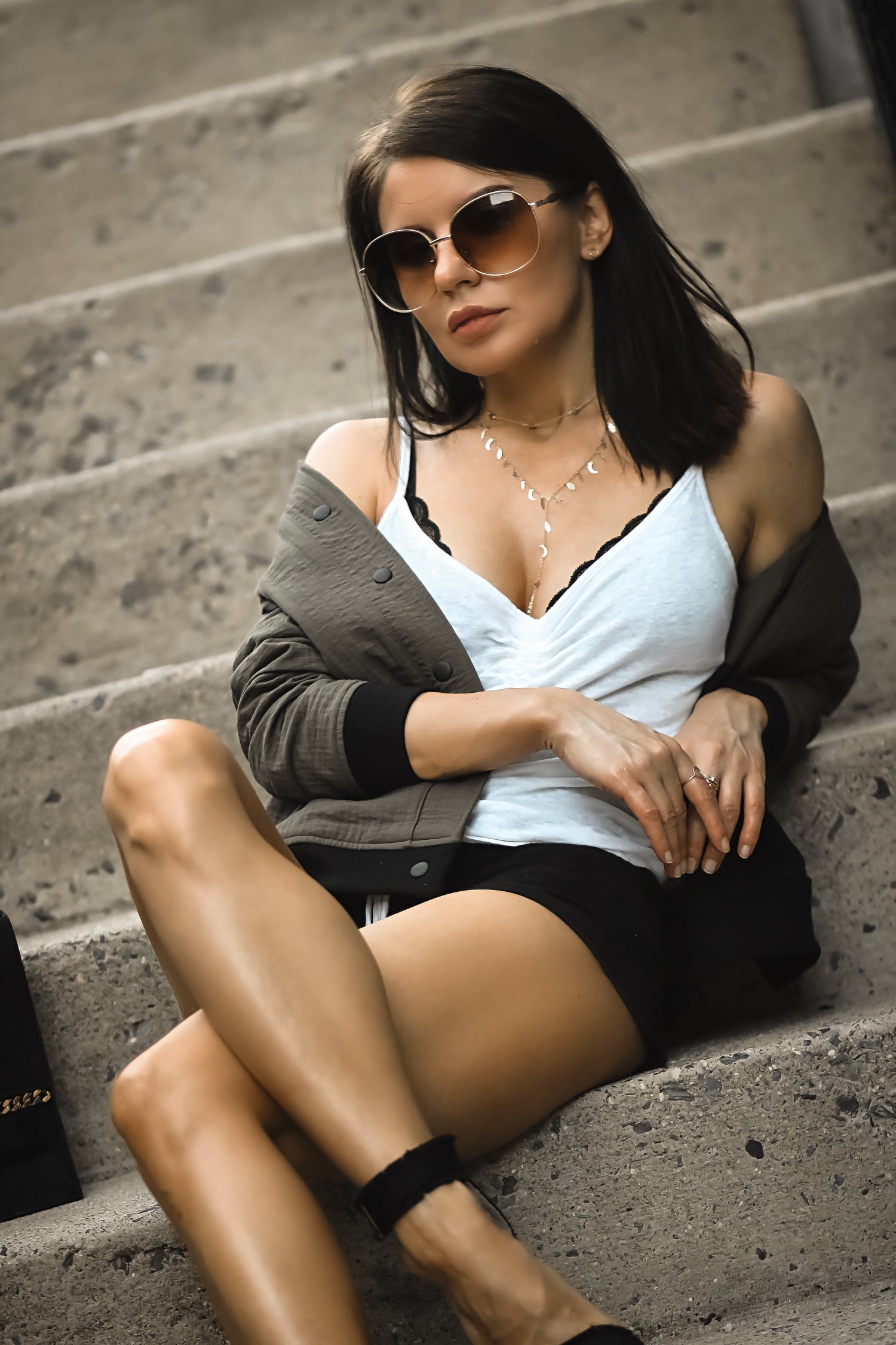 Isabel Alexander Wearing Adinas Jewels Lariat Necklace Sitting Down Stairs