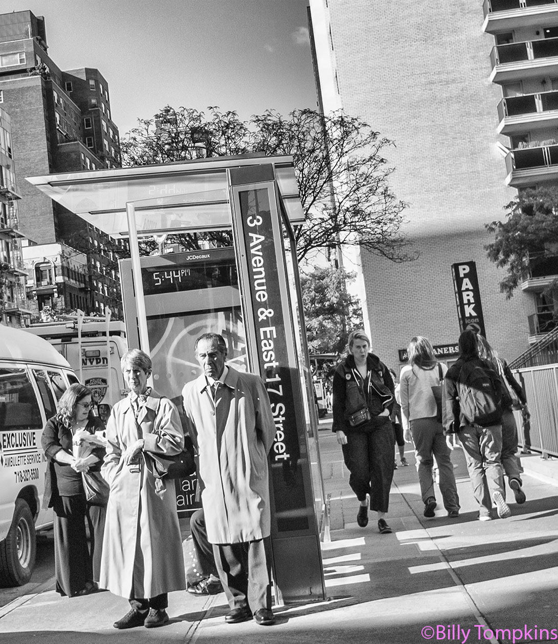  Older couple waiting for the bus. 