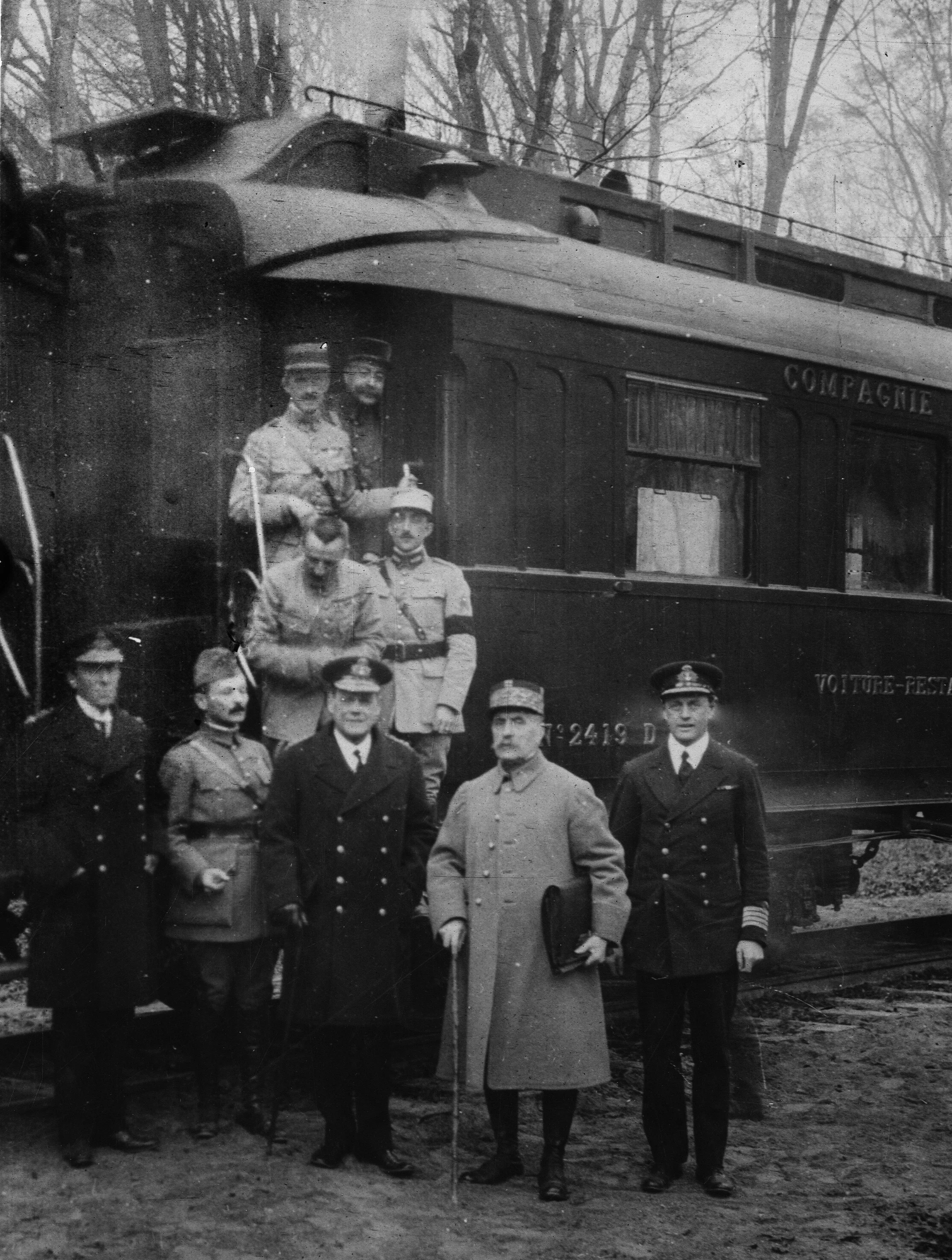 Marshal Foch with members of the Allied delegation outside the railway carriage where the armistice with Germany was signed. 
