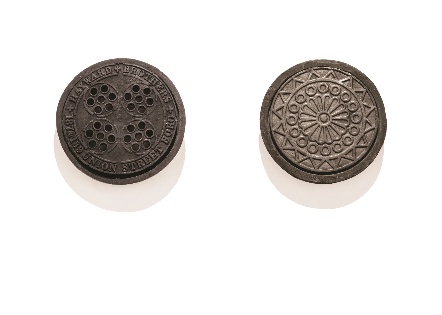  Commemorate SW19, 2012 & Commemorate SE1, 2013 Coal hole covers cast in compressed charcoal dust