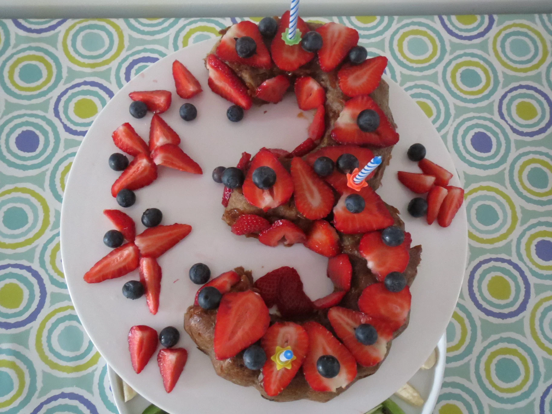 The 3 was created by making two cakes decoration ideas I make a apricot paste (dried apricots cooked in some water and pureed) and then spread it on the top - afterwards you can sprinkle coconut or add chopped strawberries or other fruit.