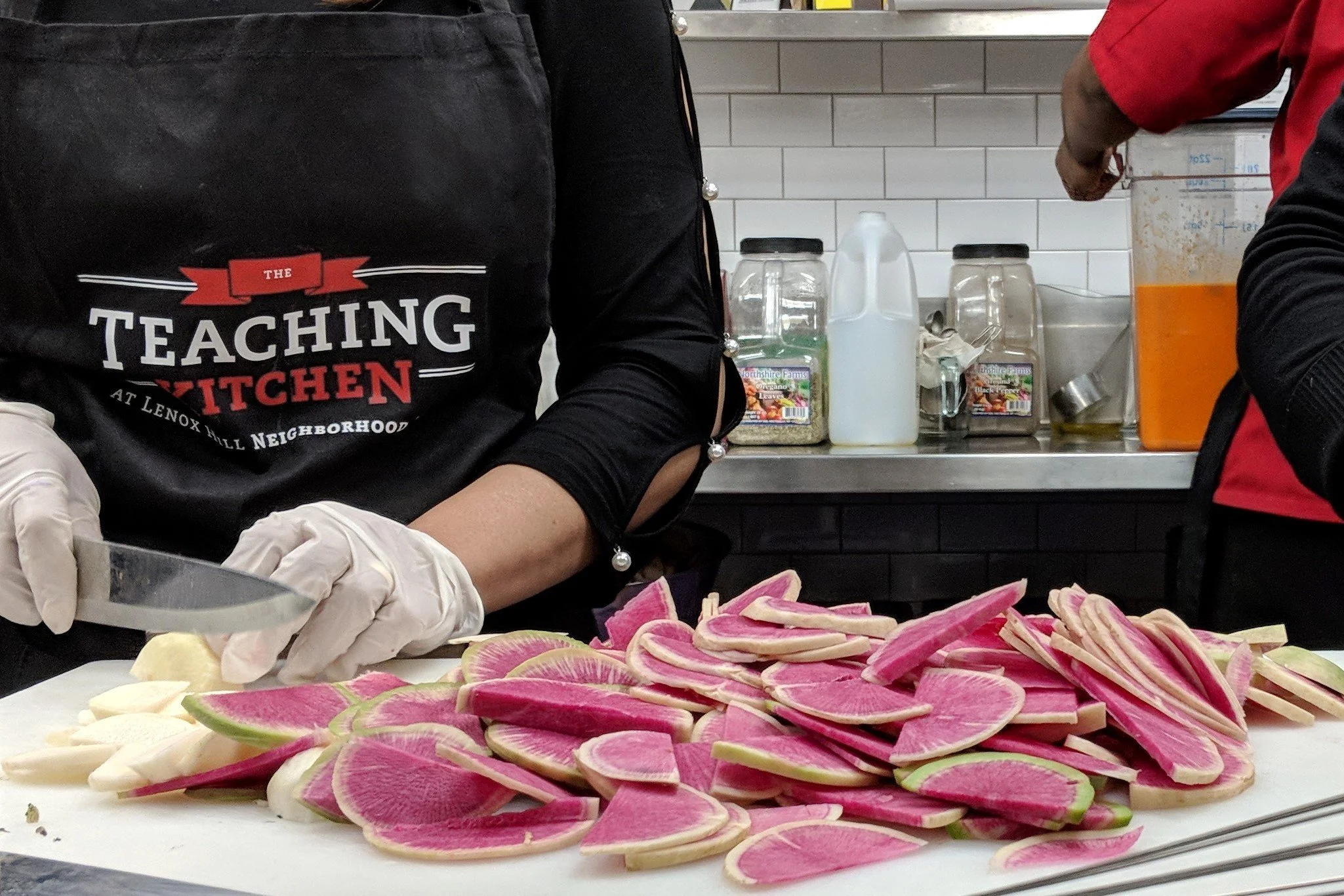 Chef slicing watermelon radishes