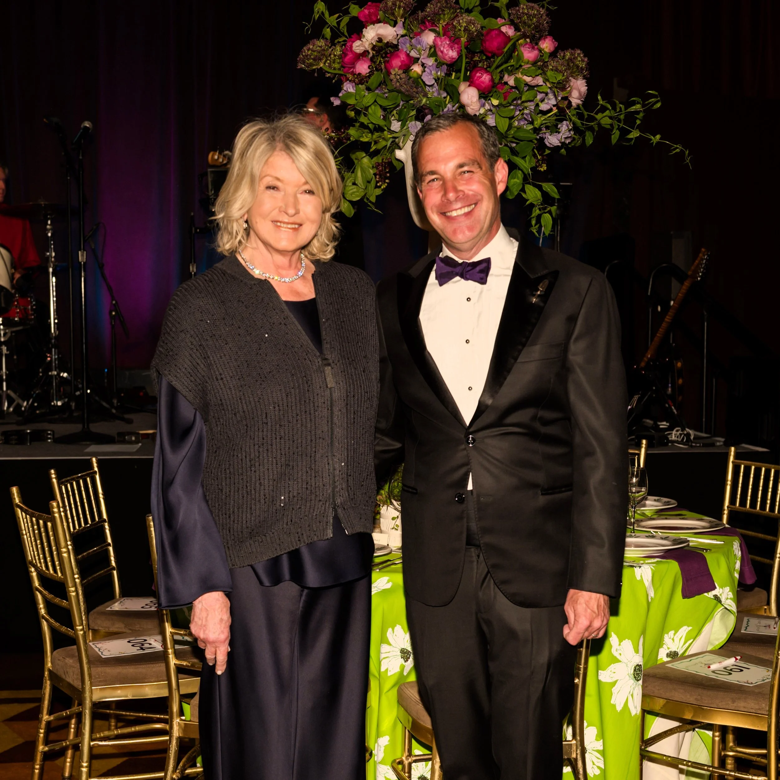 Martha Stewart & Christopher Spitzmiller standing in front of floral tablescape