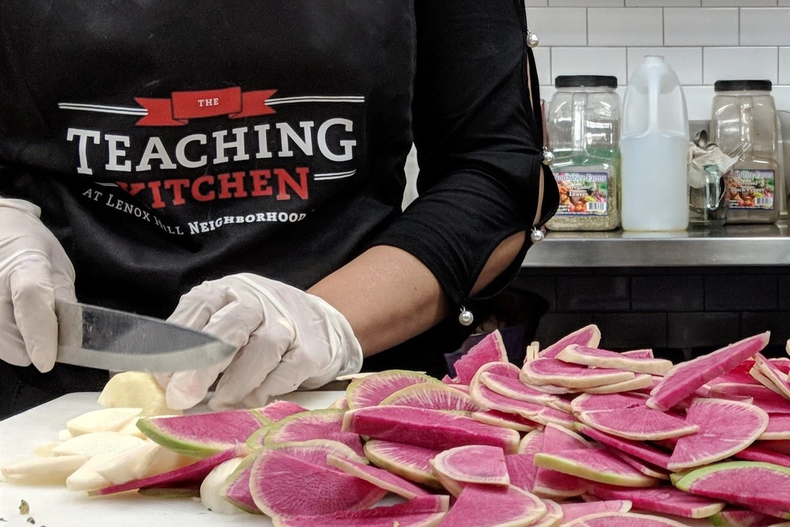 photo of person slicing watermelon radishes