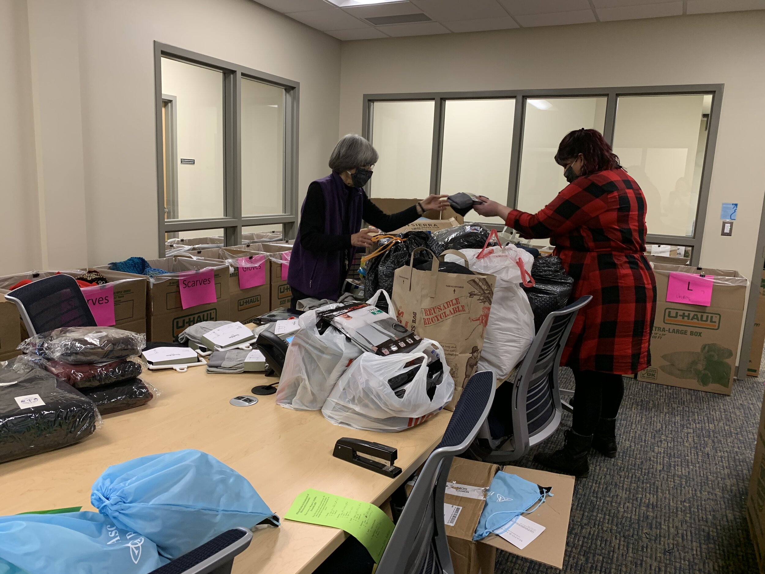  Prudence (left) sorting donations with our Volunteer &amp; Operations Coordinator, Megan Hayden (right). 