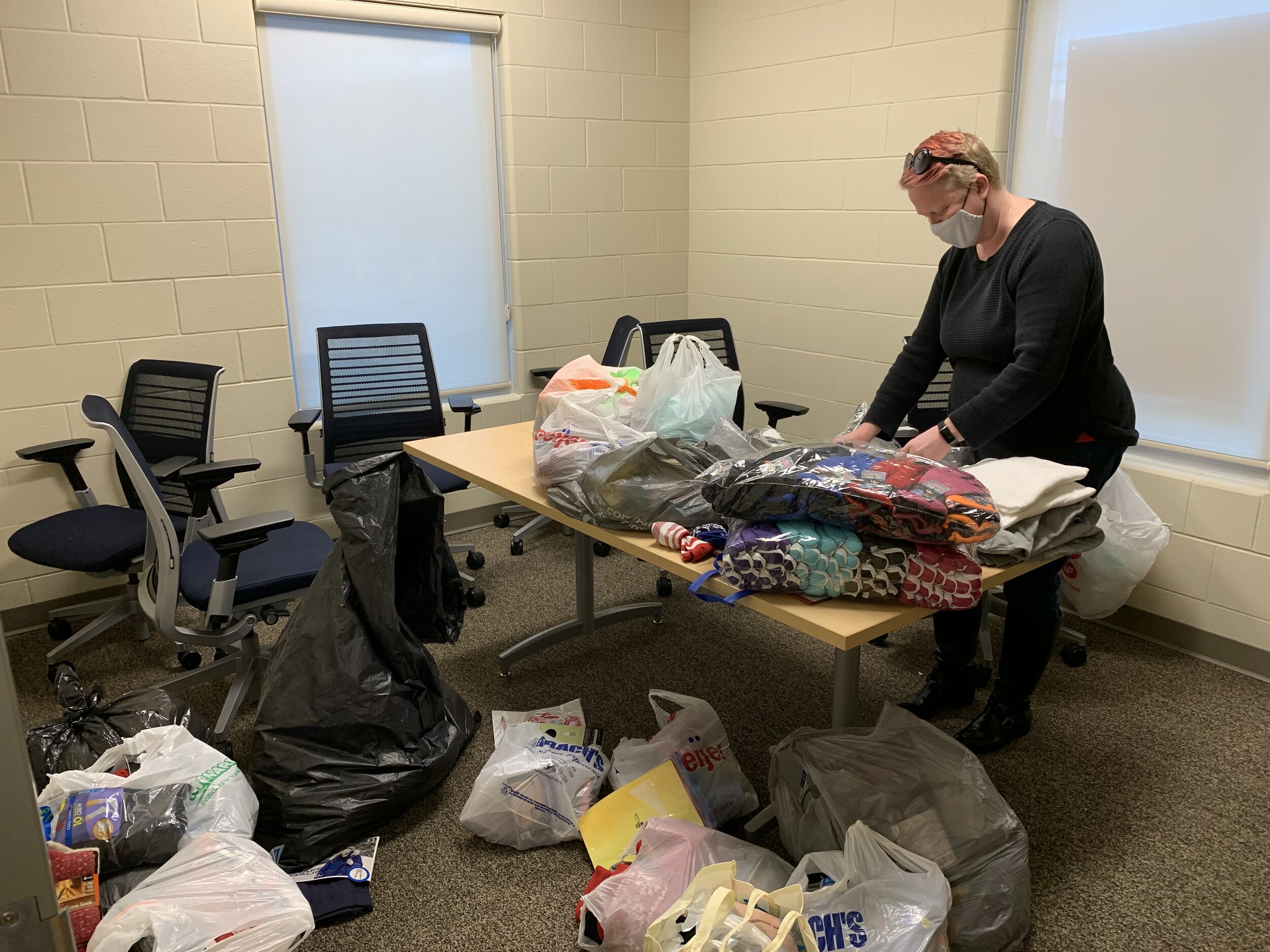  Our Executive Director, Kelly Henderson, sorting and organizing. 