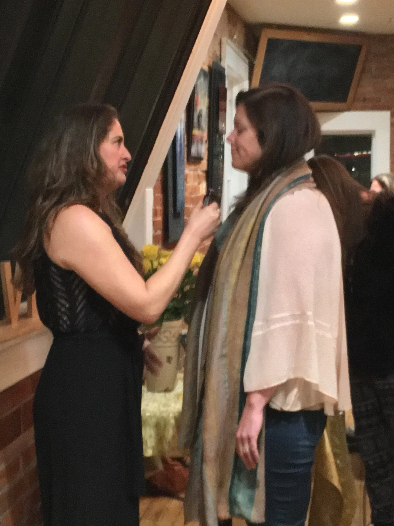 Publisher Jane Ashley anointing event guests with the healing power of essential oils at the Prosperity Activation Book Signing in Boulder, CO.