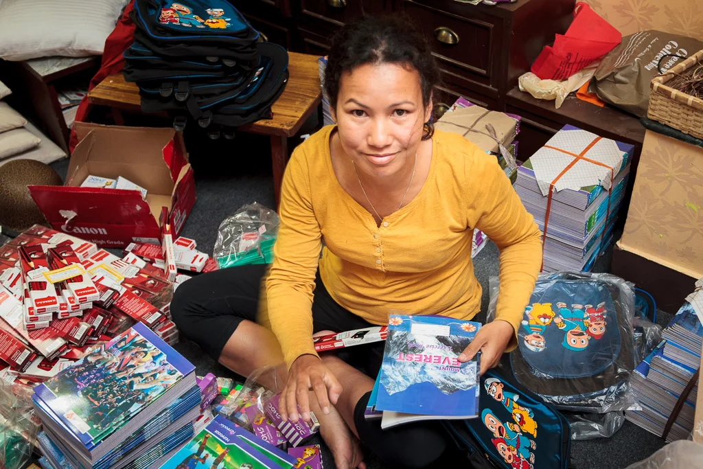 Rewati Gurung packing the first of the Moving Mountain School Bags for delivery tomorrow morning.