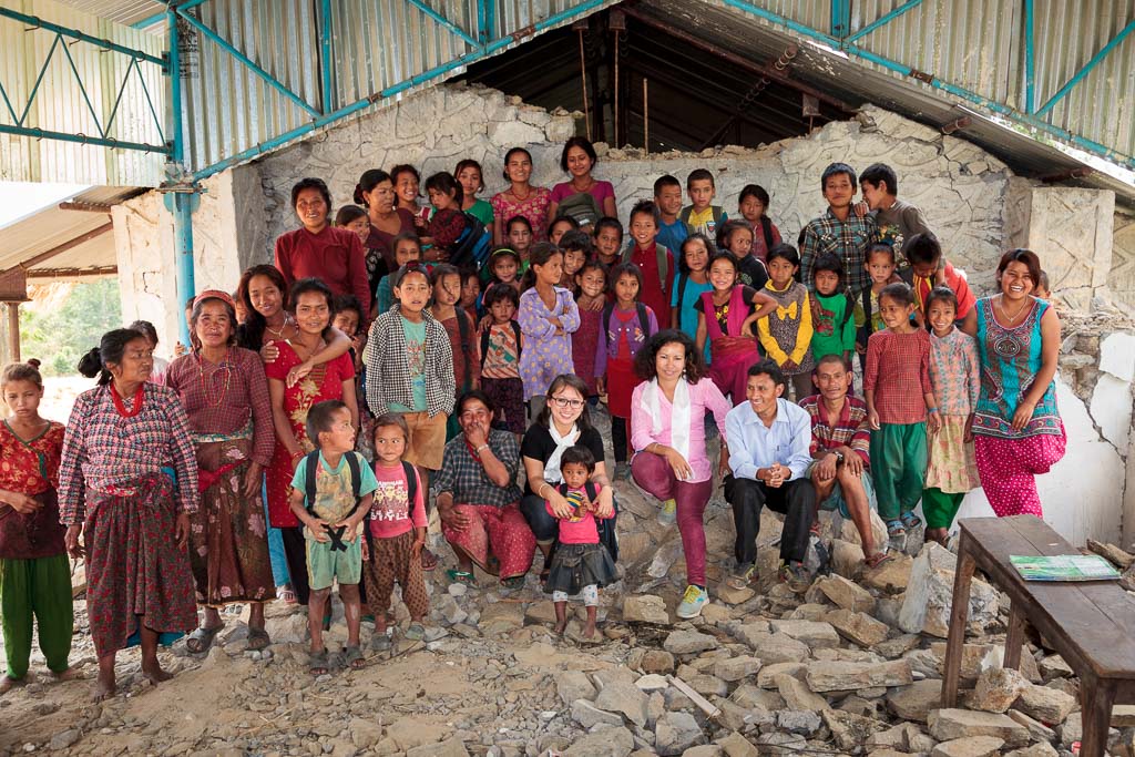  Group photograph of Rewati Gurung, Menuka, the principle of Shree Salme Primary School, Sun Bar Tamang and the pupils in the remains of the school. 