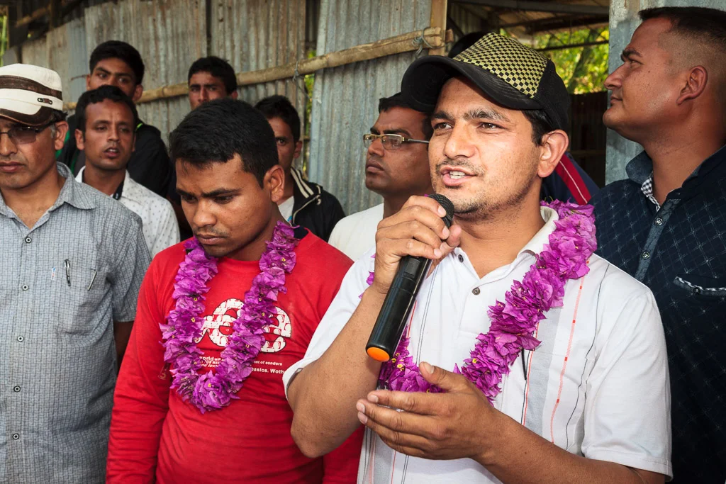 One of the villagers who came from Kathmandu speaks to the crowd about our project.