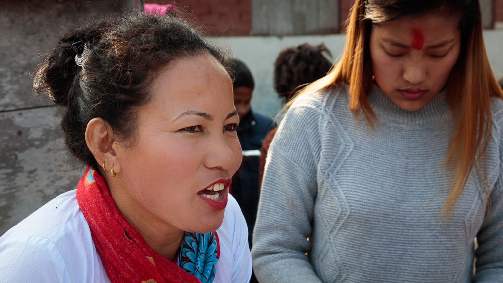 Jyotica and Sarada Gurung helping out with the distribution of bags and school equipment.