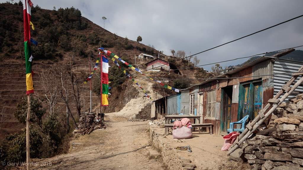 A view of the village with the new school house perched on the side of the hill.
