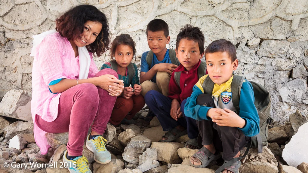 Some of the children from Shree Salme primary school during donation day in 2015. The boy on the right poses with Rewati Gurung in the photo below.